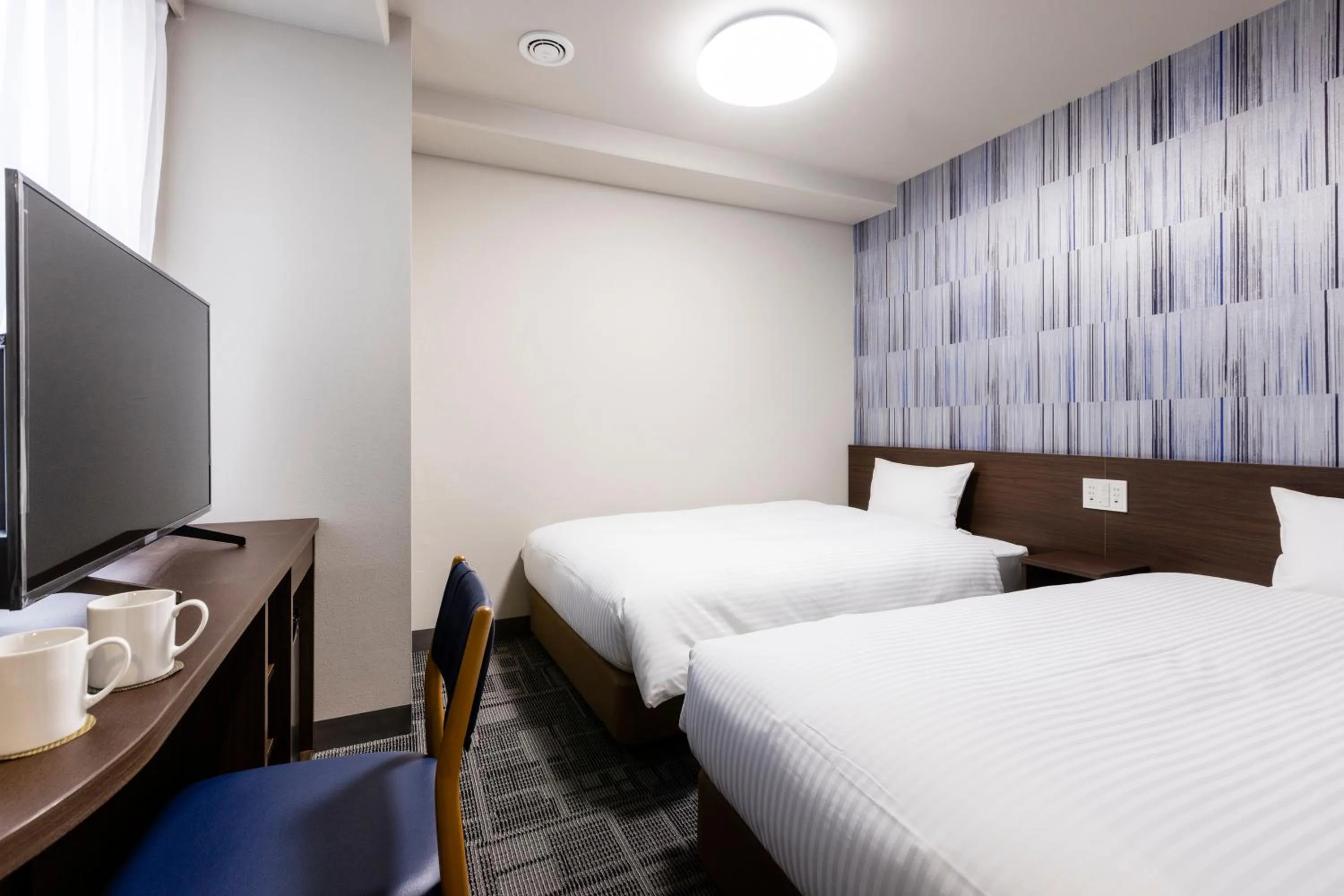 Photo of the whole room, Bed in KOKO HOTEL Shizuoka - formerly Hotel Wing International Shizuoka