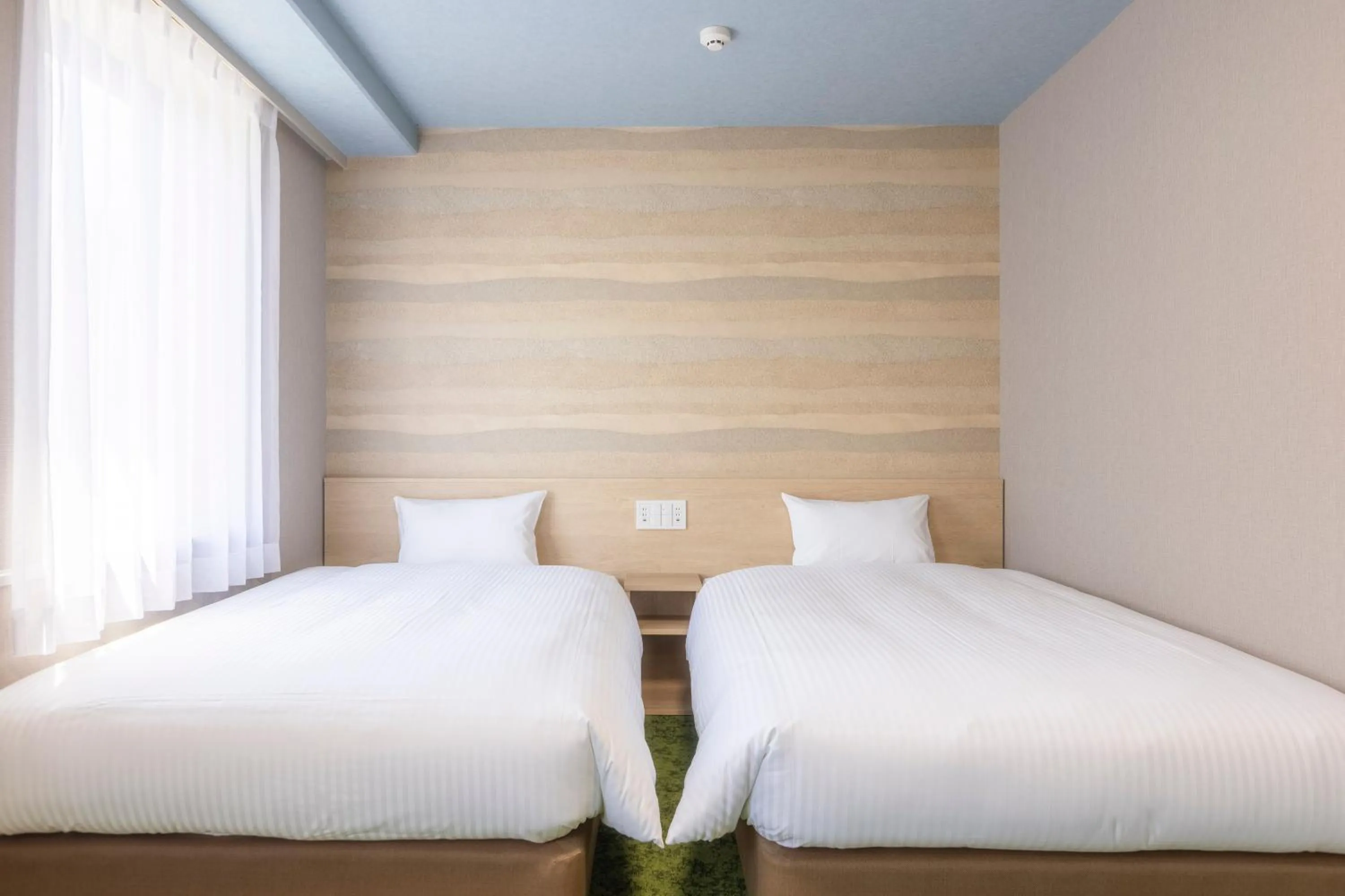 Bed in KOKO HOTEL Shizuoka - formerly Hotel Wing International Shizuoka