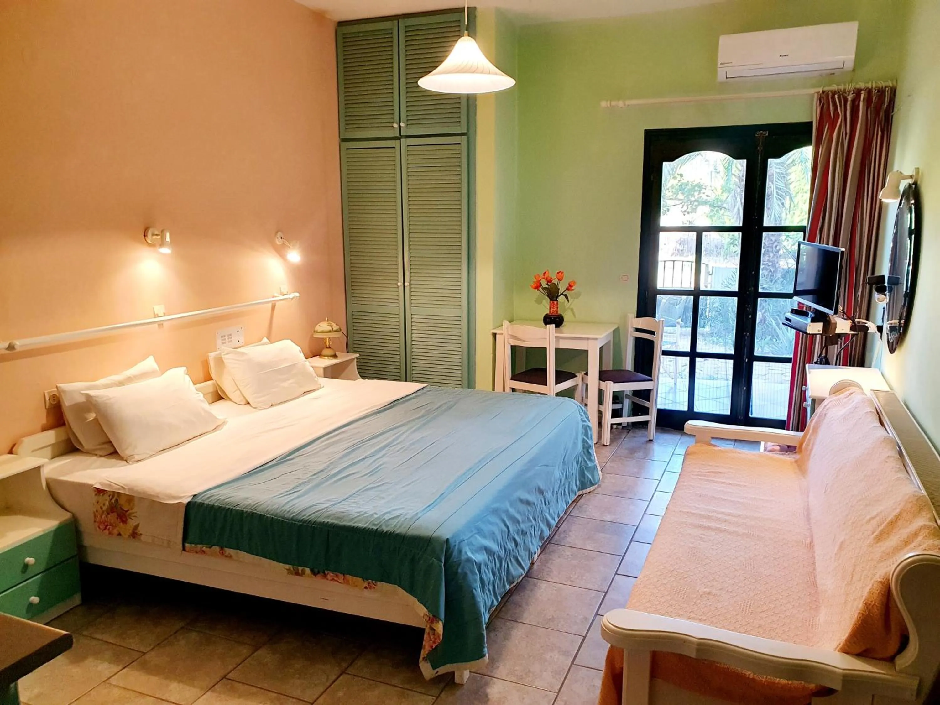 Seating area, Bed in Dioskouroi Apts