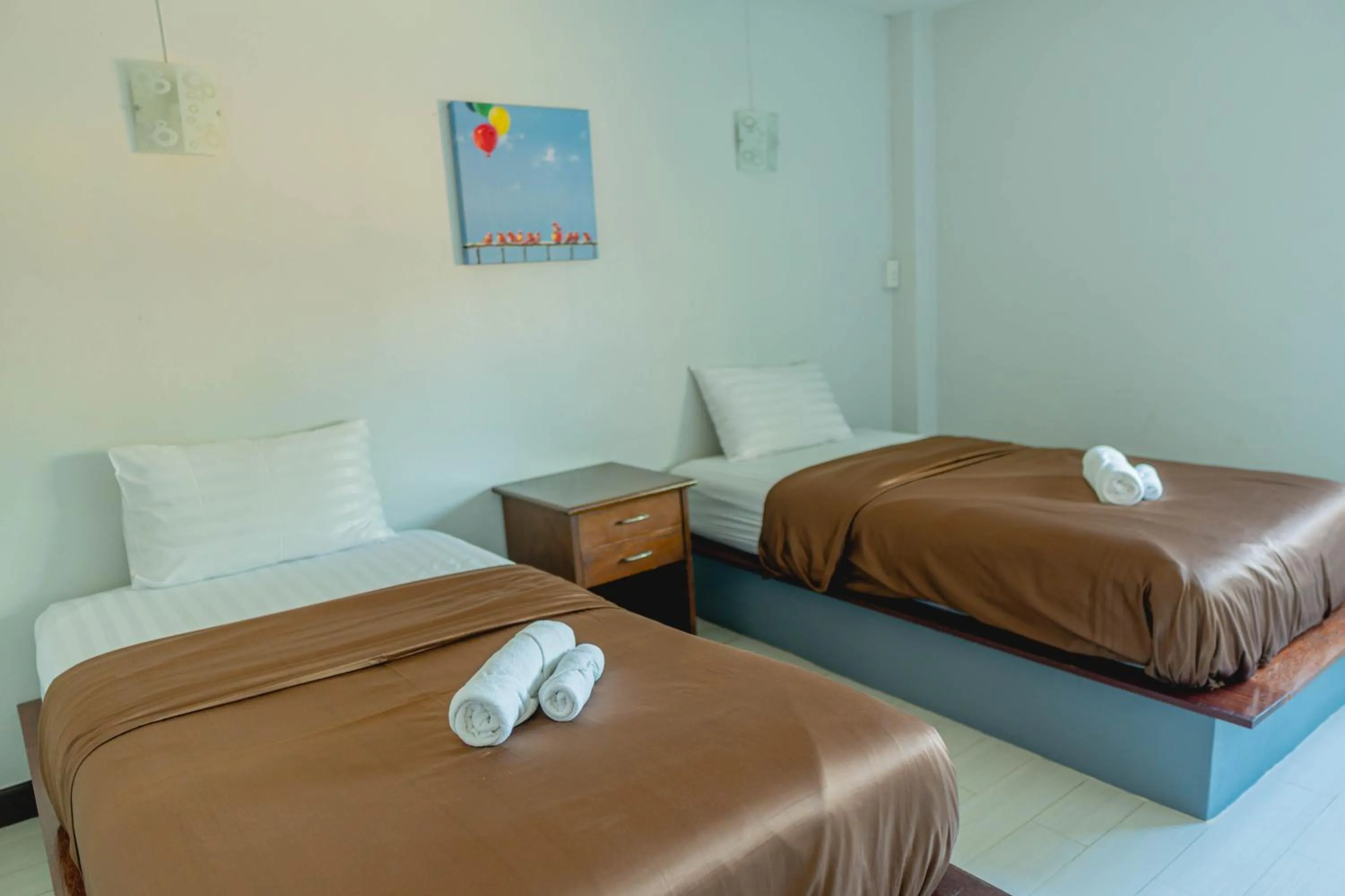 Bed in Apinya Resort Bangsarey