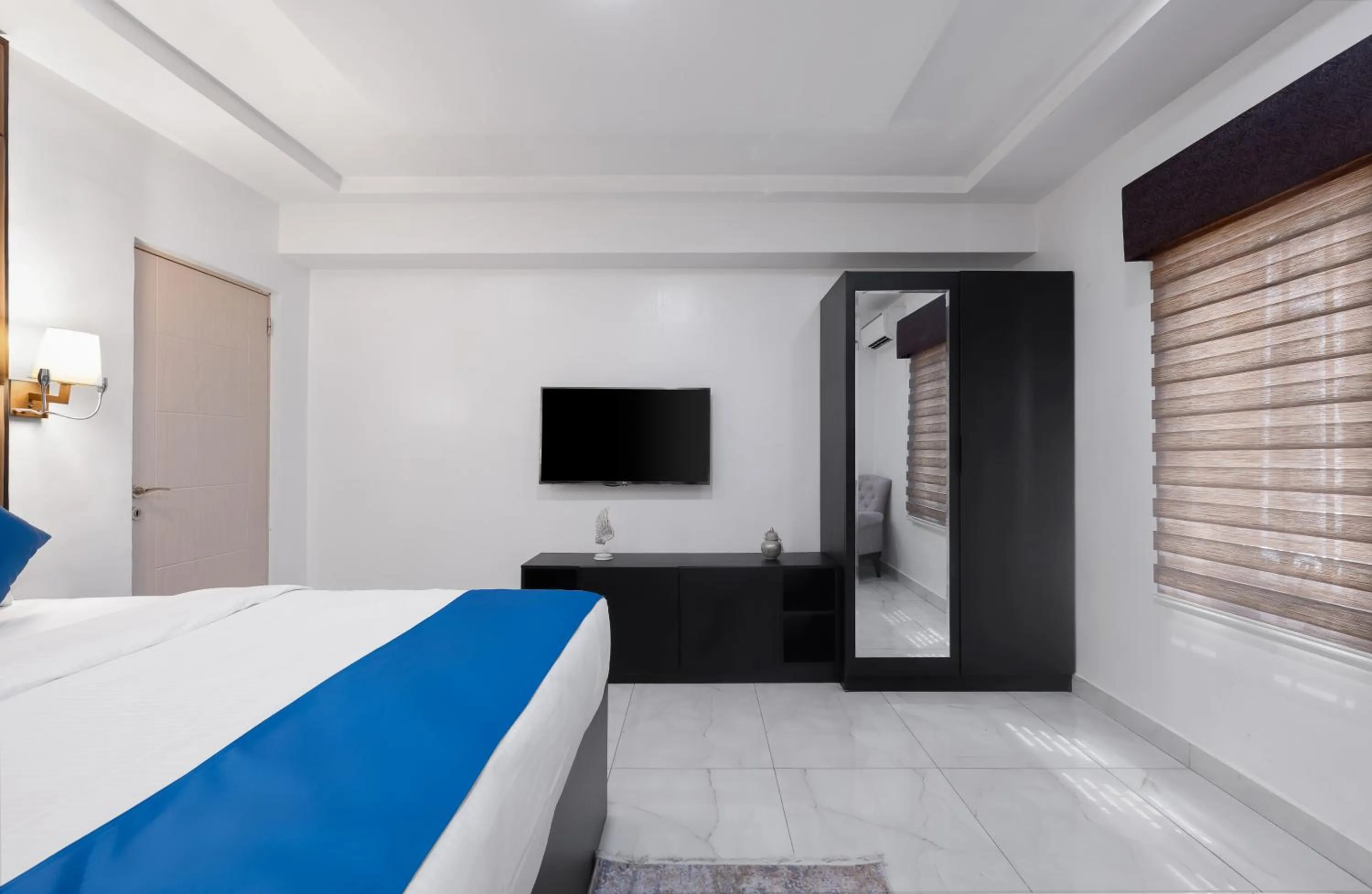 Communal lounge/ TV room, Bed in BKT Cribs - Apartments & Suites