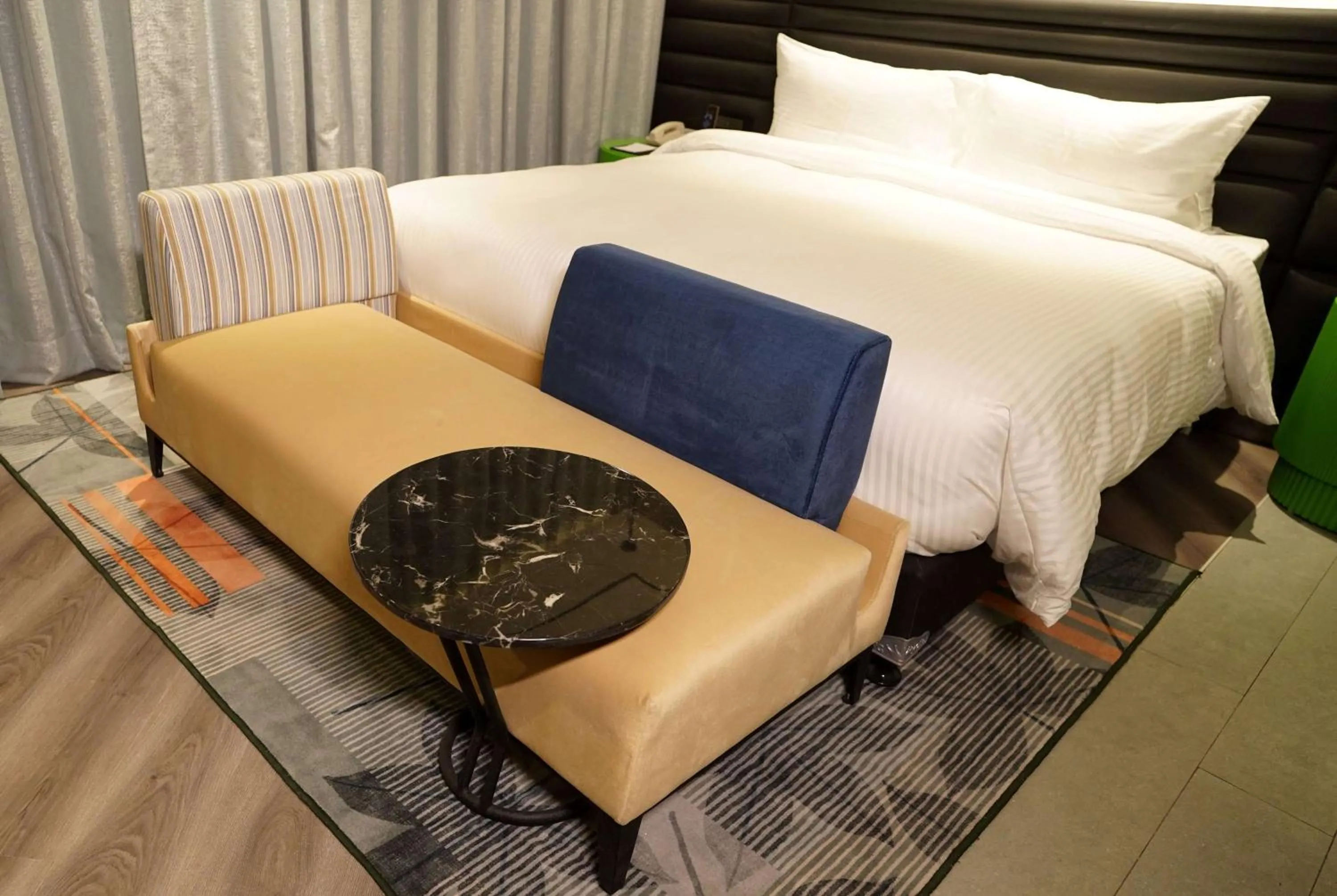 Photo of the whole room, Bed in Ramada Encore by Wyndham Bareilly Civil Lines