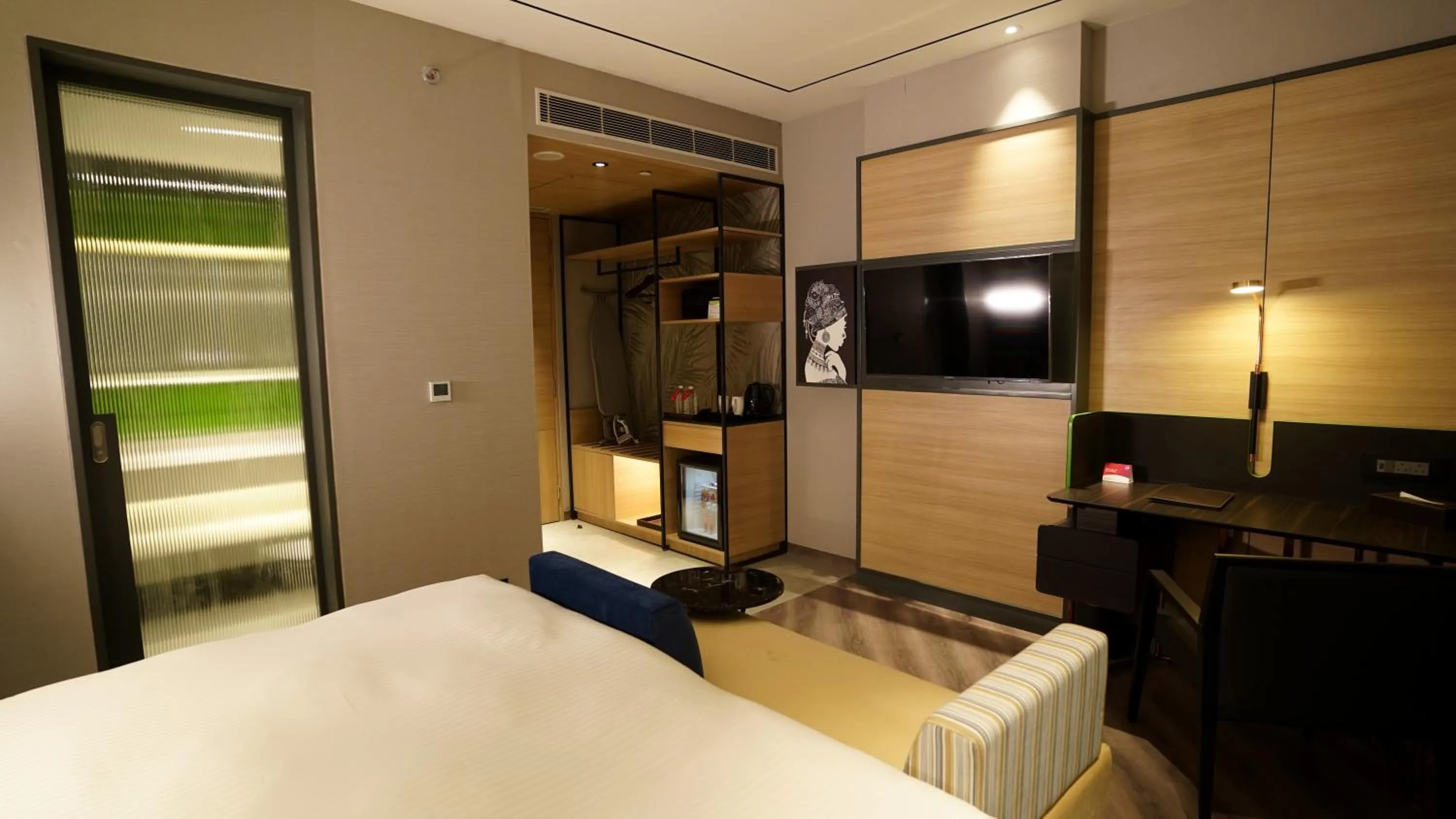 Seating area, Bed in Ramada Encore by Wyndham Bareilly Civil Lines