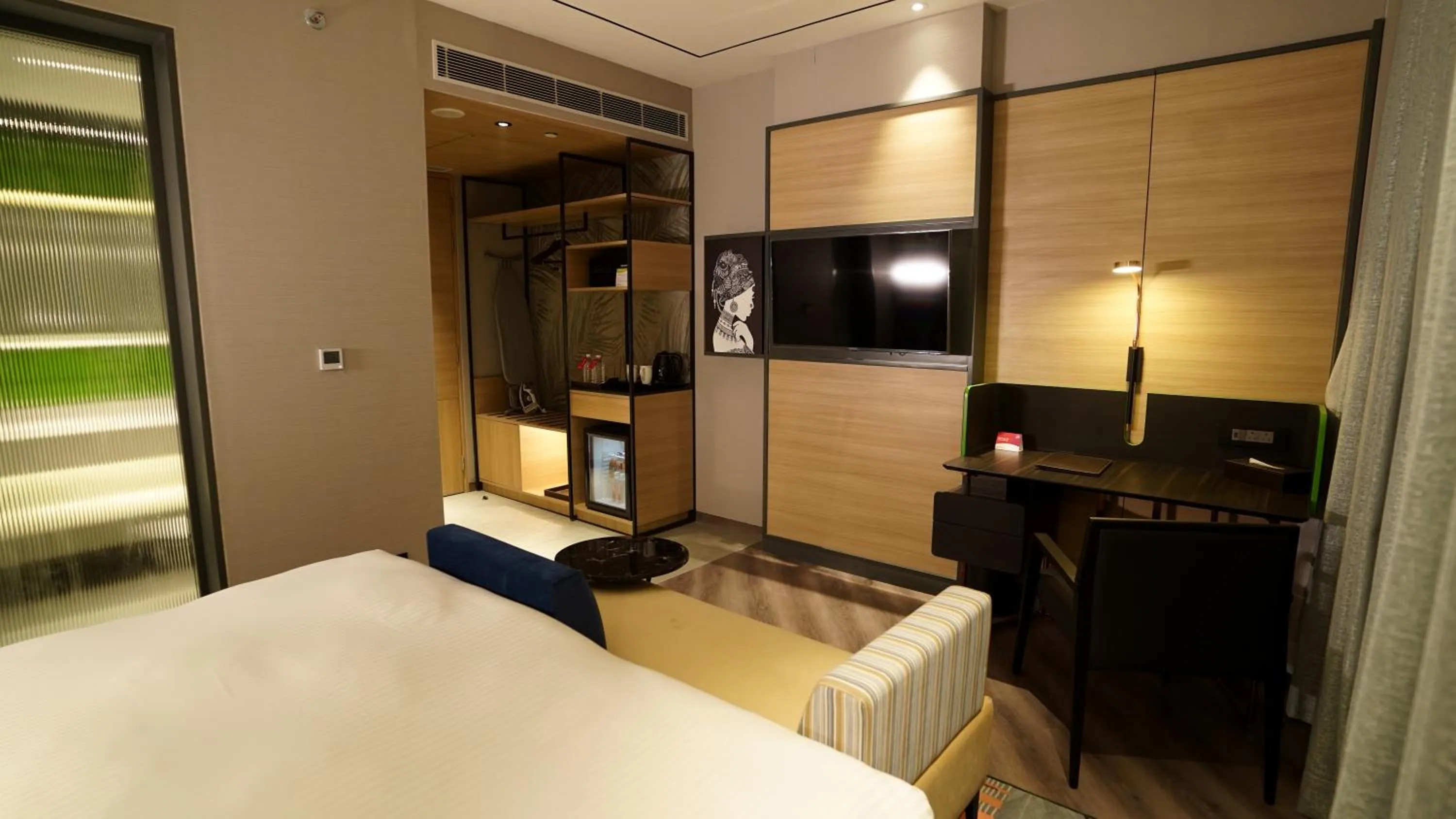 Seating area, Bed in Ramada Encore by Wyndham Bareilly Civil Lines