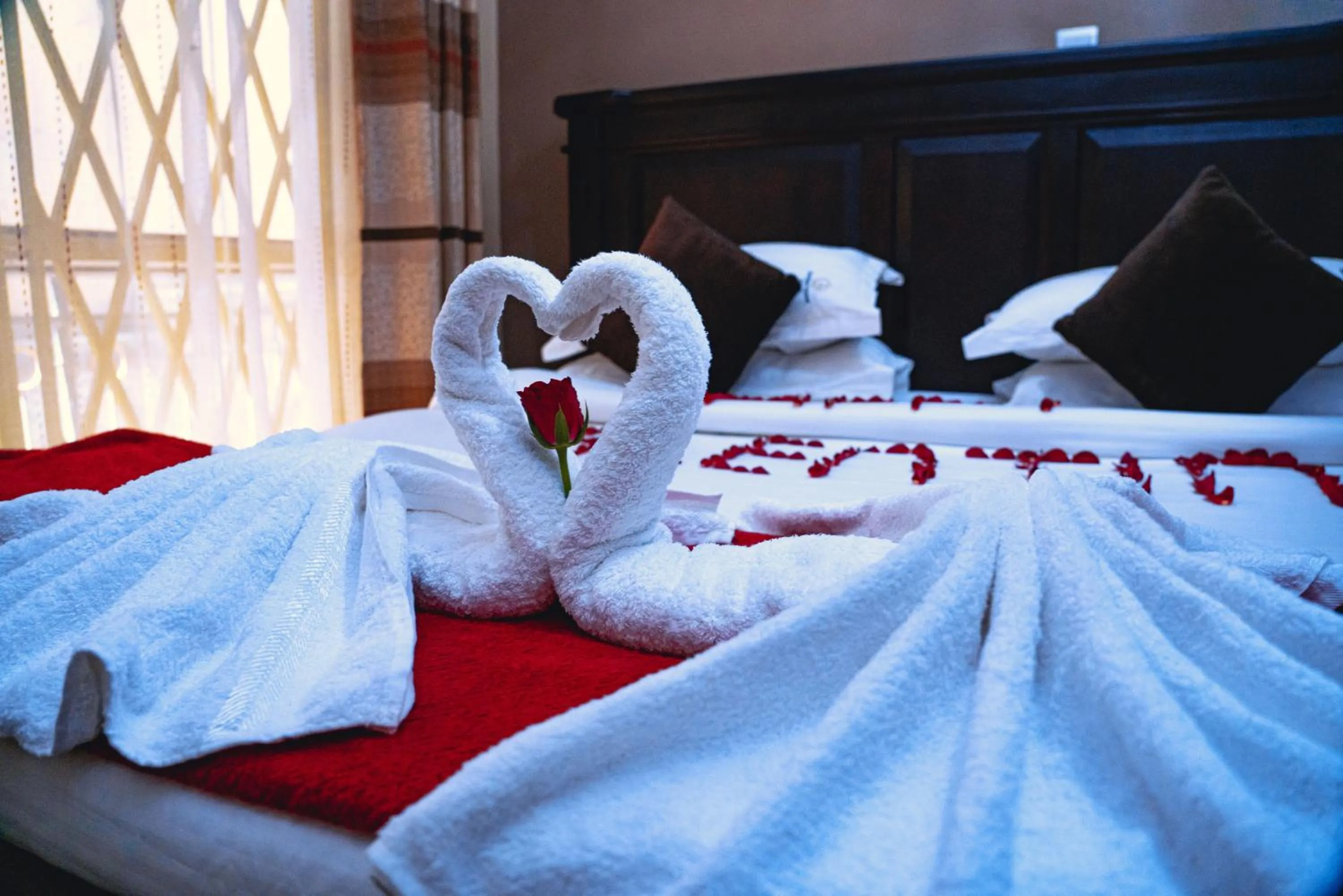 Bed in GOLDEN QUEST HOTEL