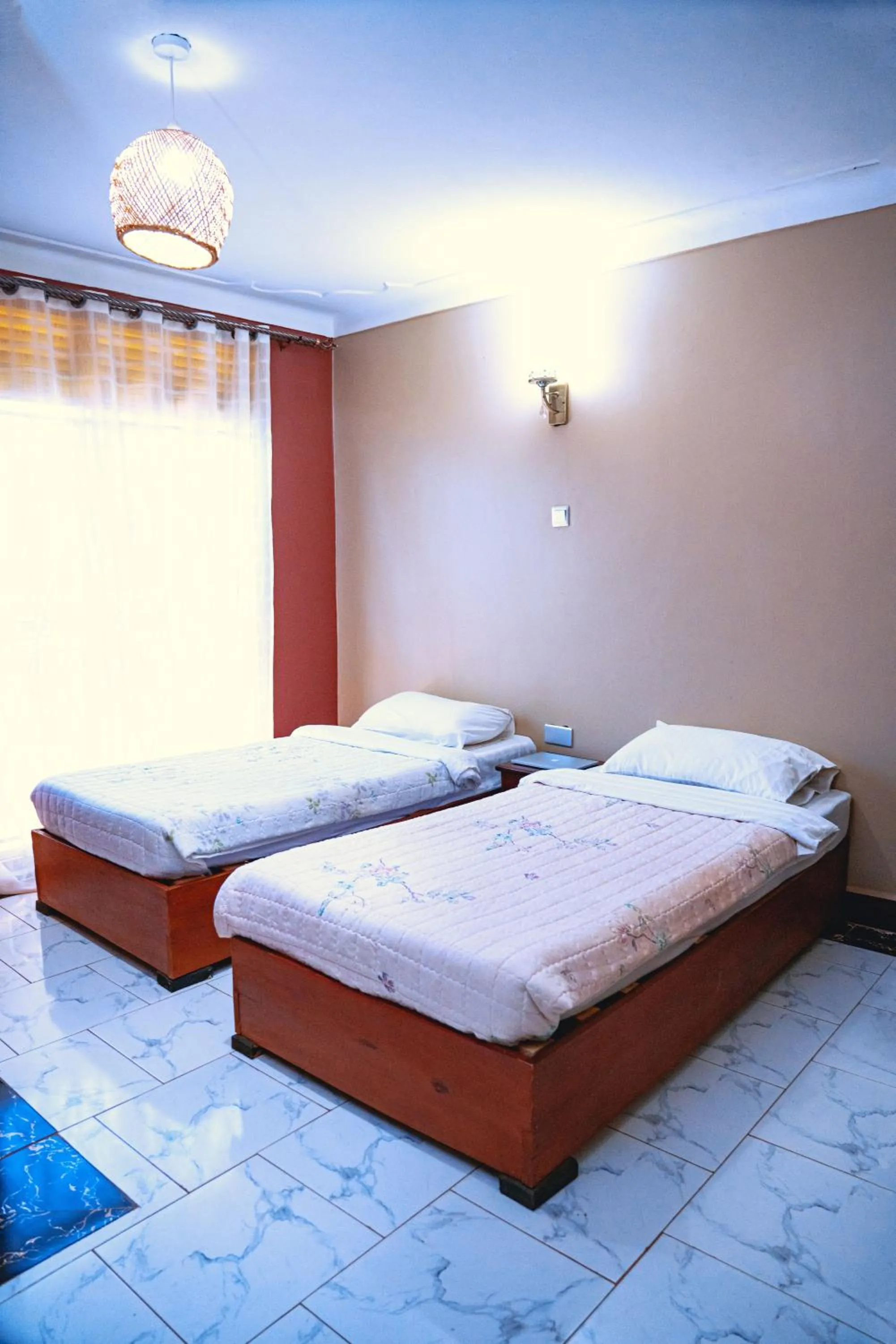 Bed in GOLDEN QUEST HOTEL