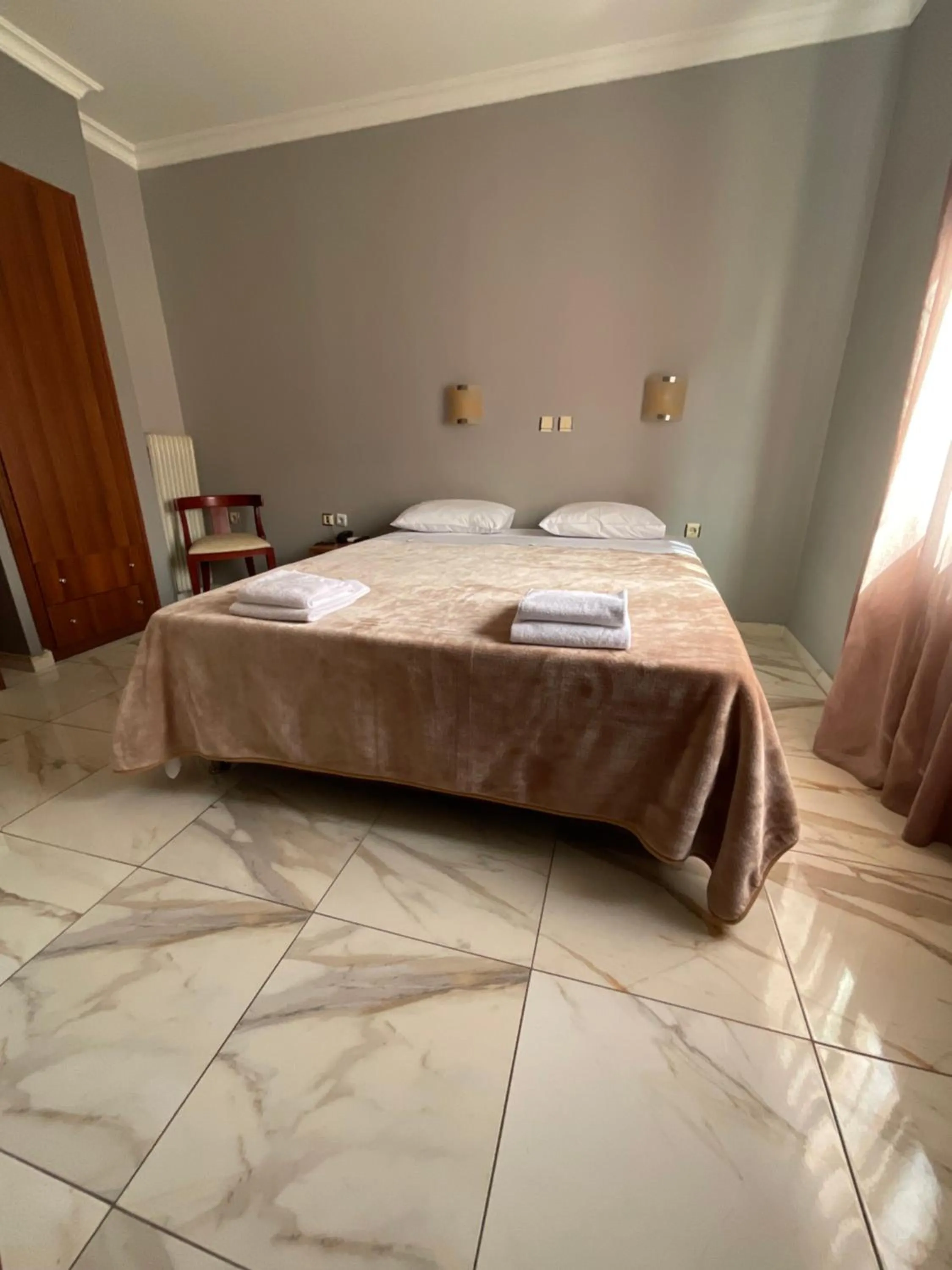 Bed in Piraeus Acropole Hotel