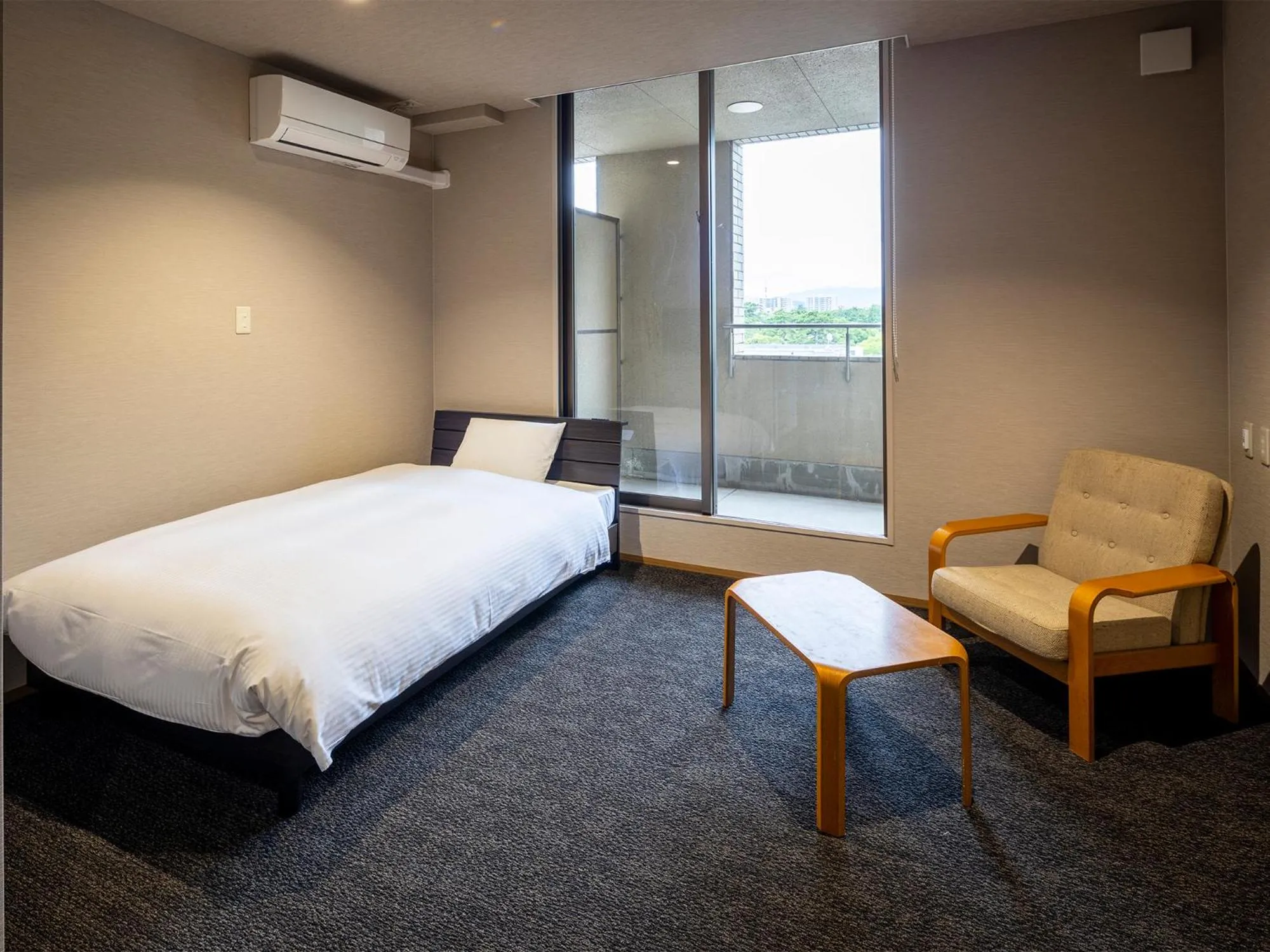 Bed in KANEMITSU CAPITAL HOTEL