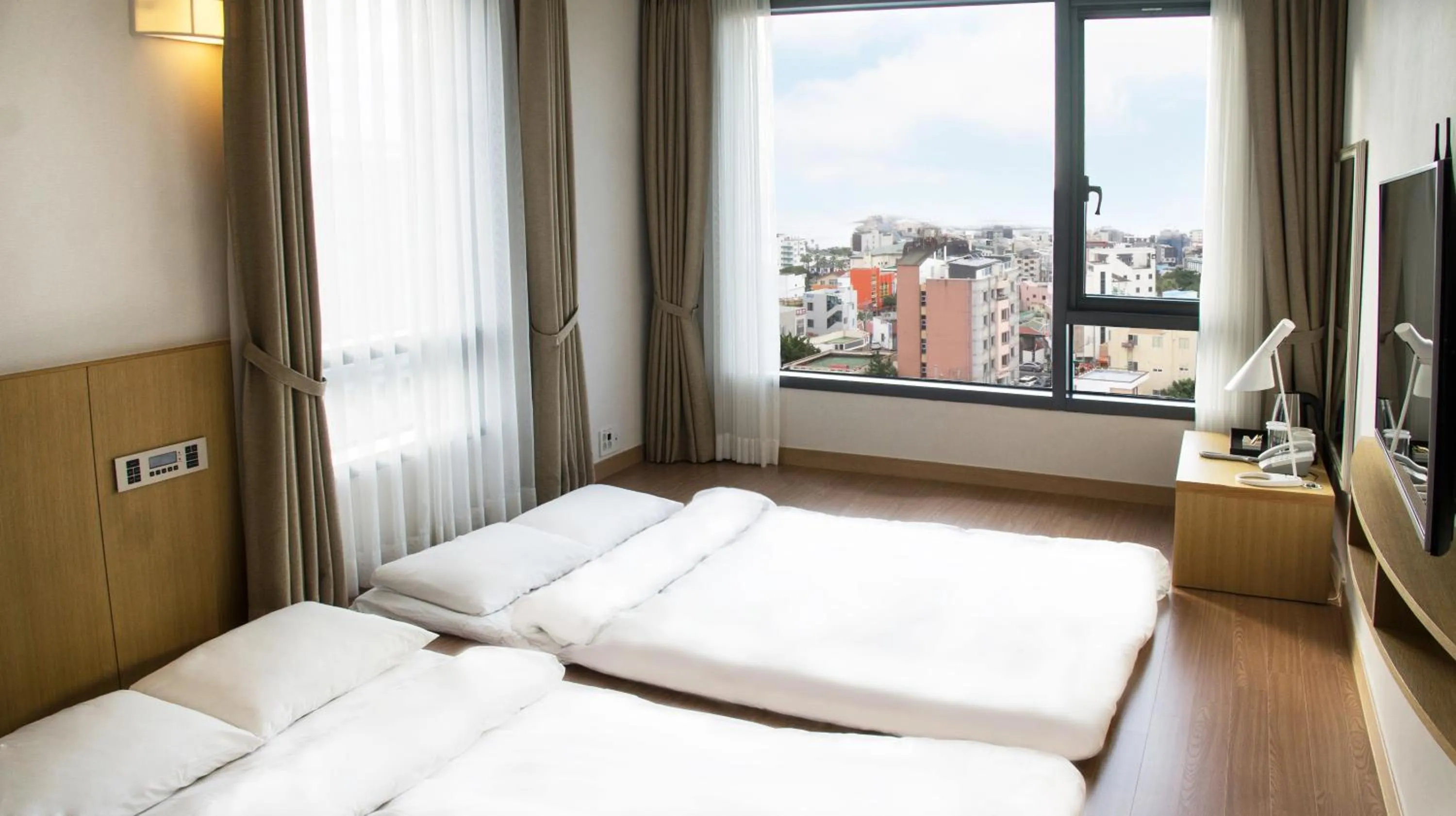 Bed in Jeju Hotel the M