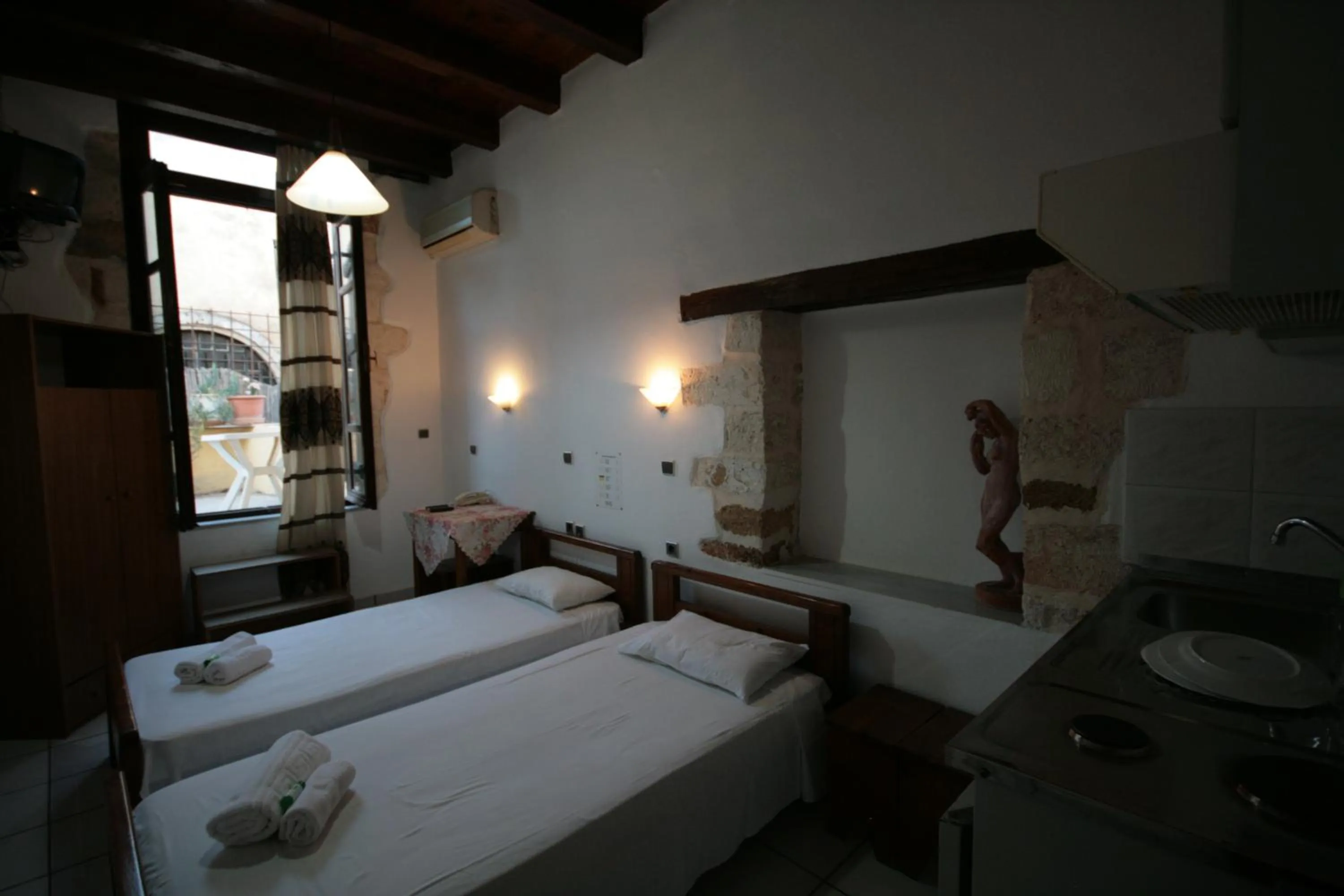 Bed in Chania Rooms