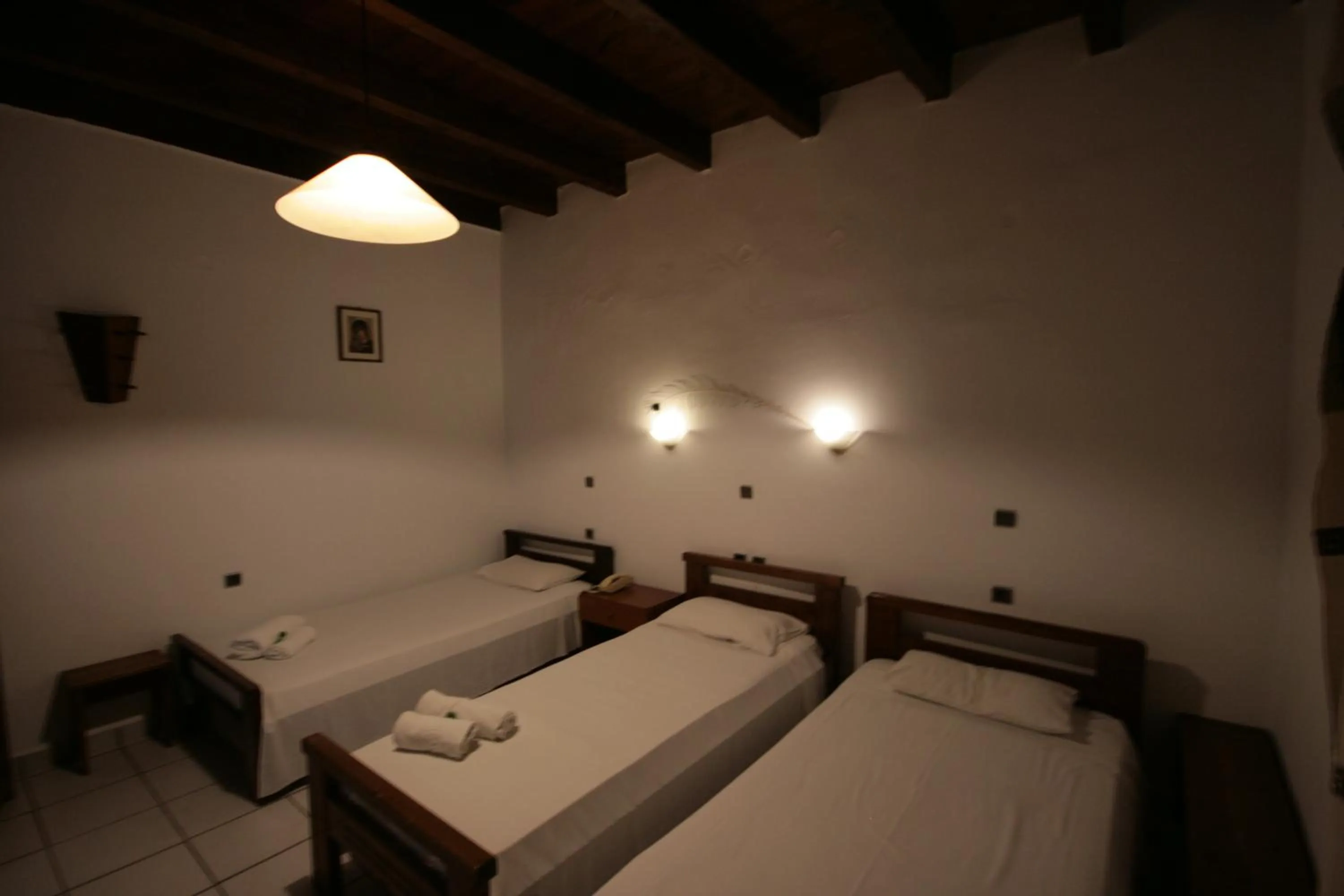 Bed in Chania Rooms
