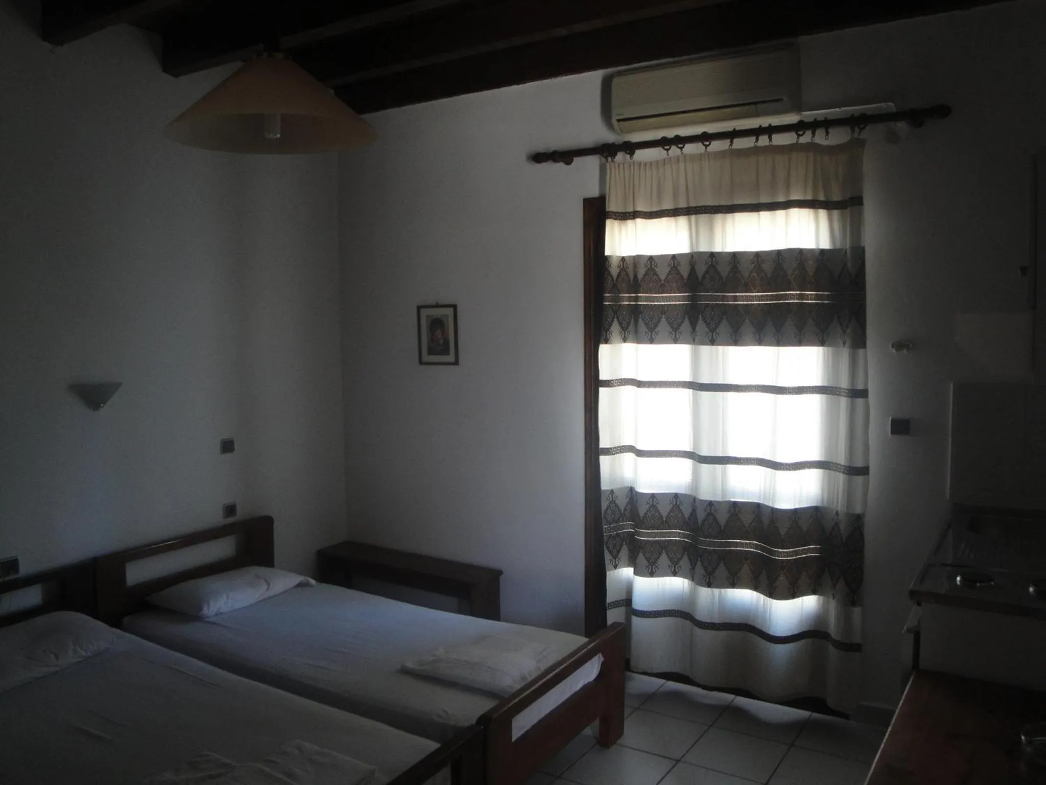 Bed in Chania Rooms
