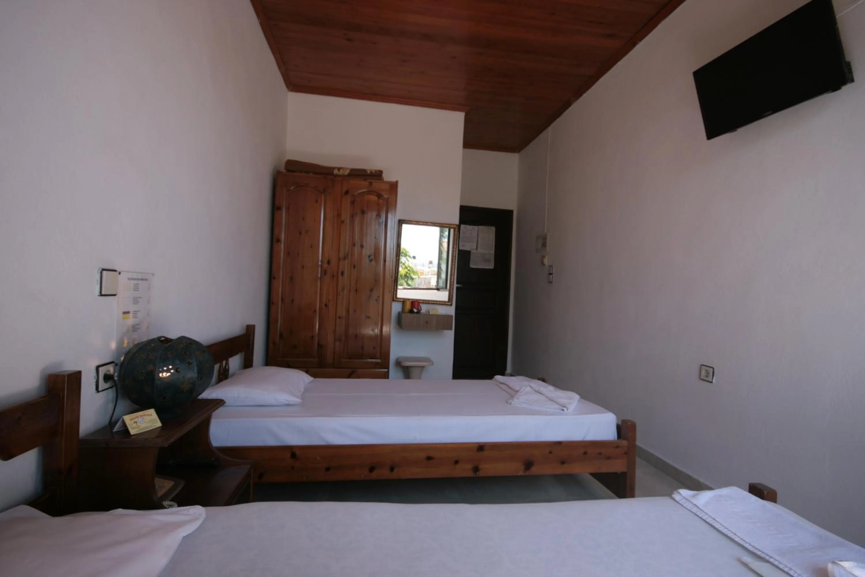 Bed in Chania Rooms