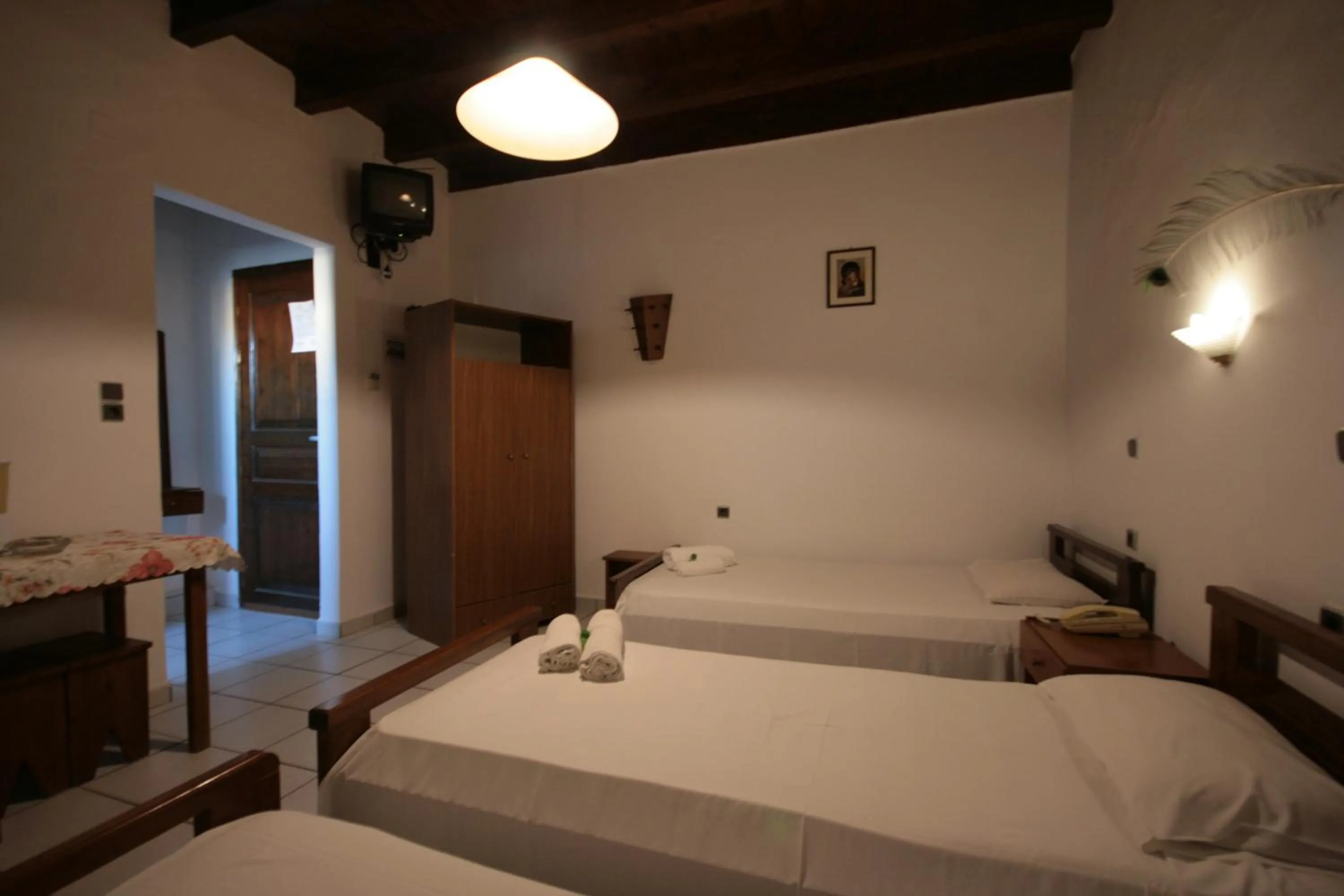 Bed in Chania Rooms