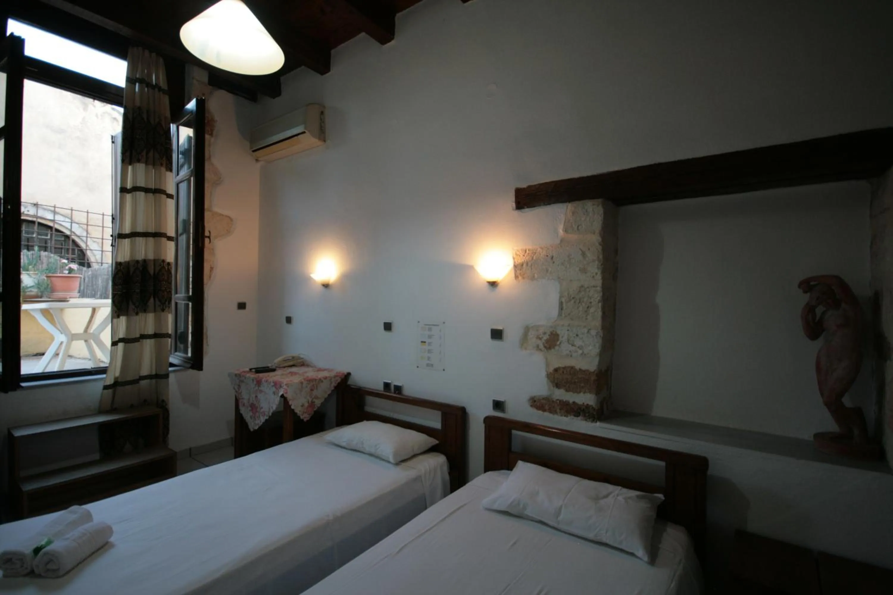 Bed in Chania Rooms