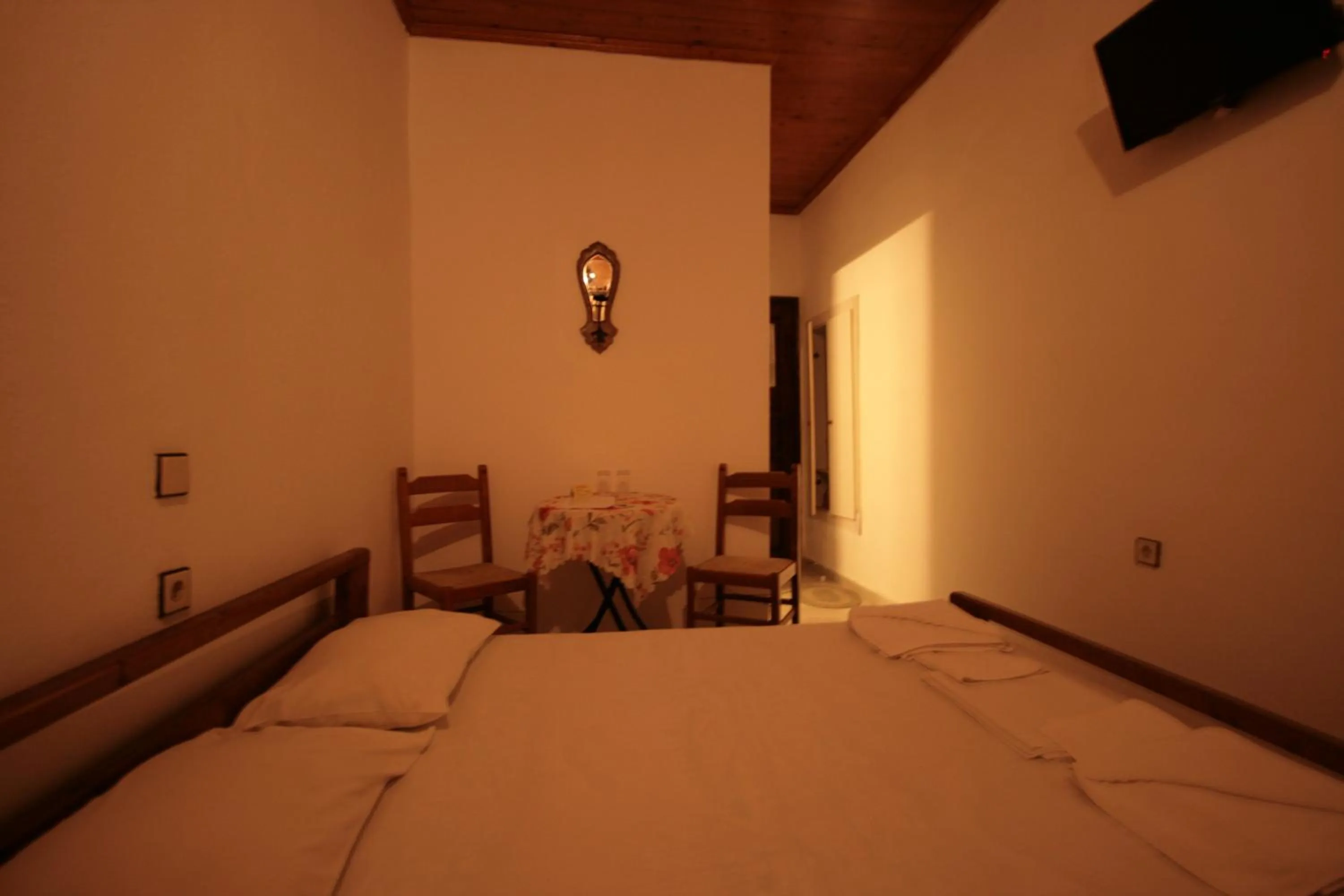 Bed in Chania Rooms