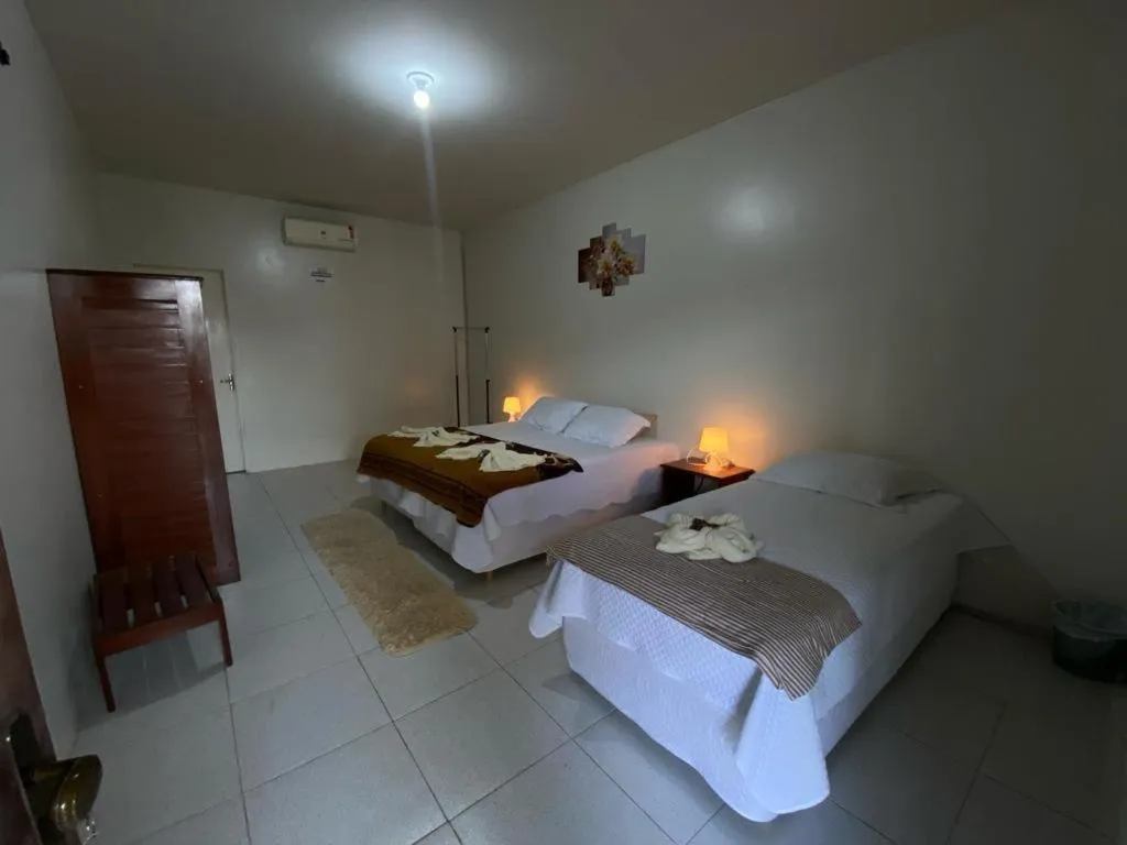 Bed in POUSADA ESTRELA DA MANHÃ