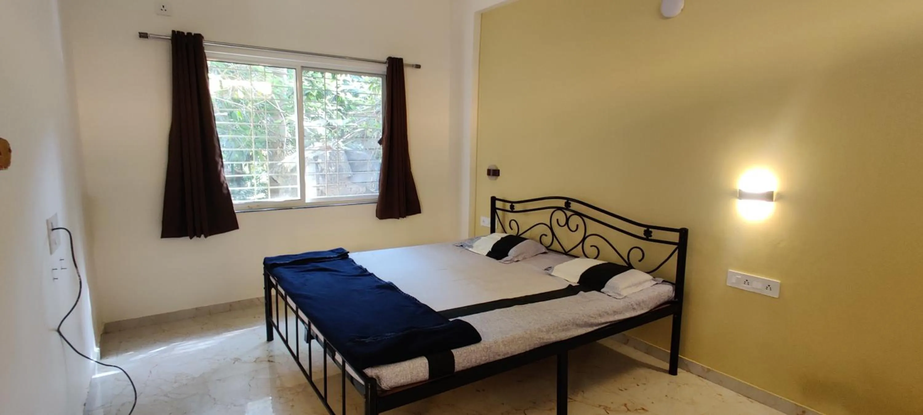 Bed in Shree Swami Samarth Resort