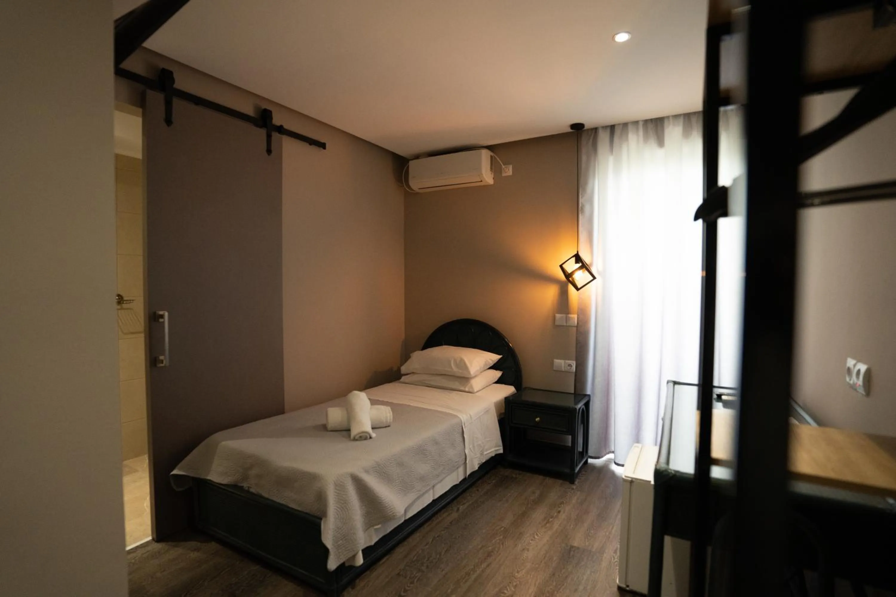 Bed in Parthenis Riviera Hotel