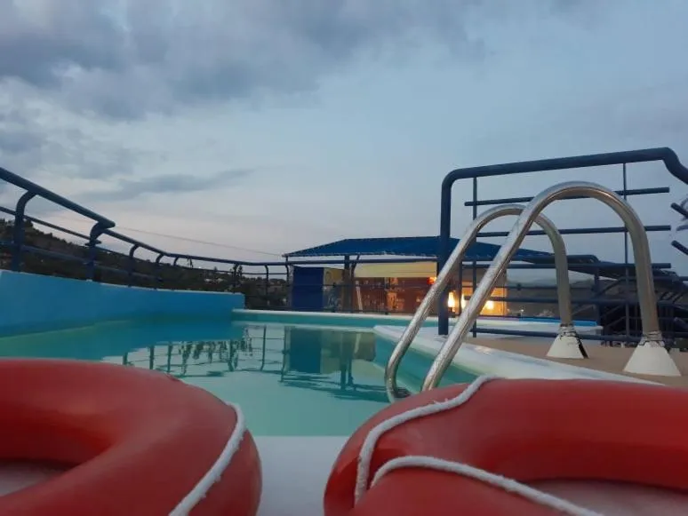 Swimming pool in Heliotopos Apartments