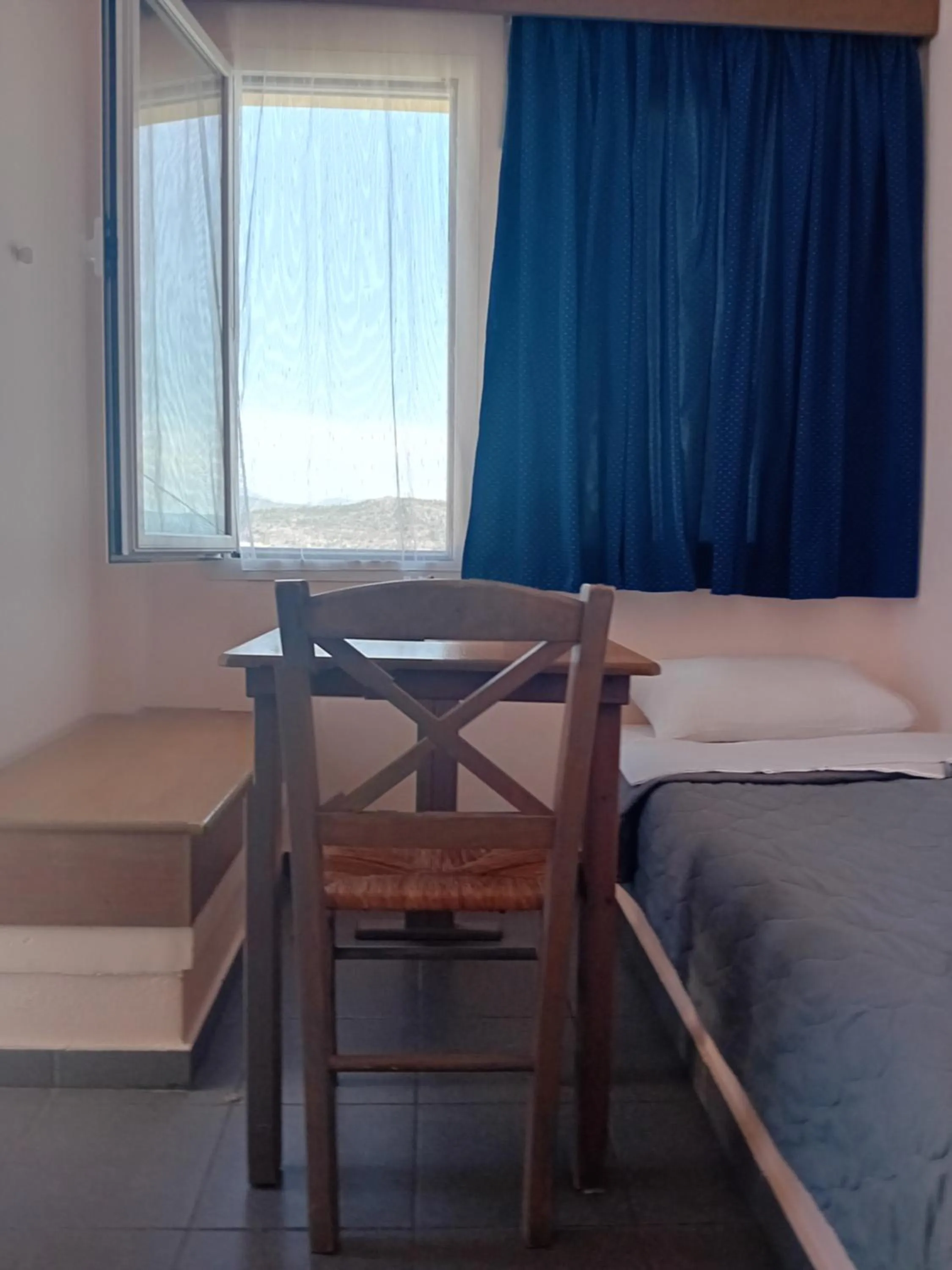 Bed in Heliotopos Apartments