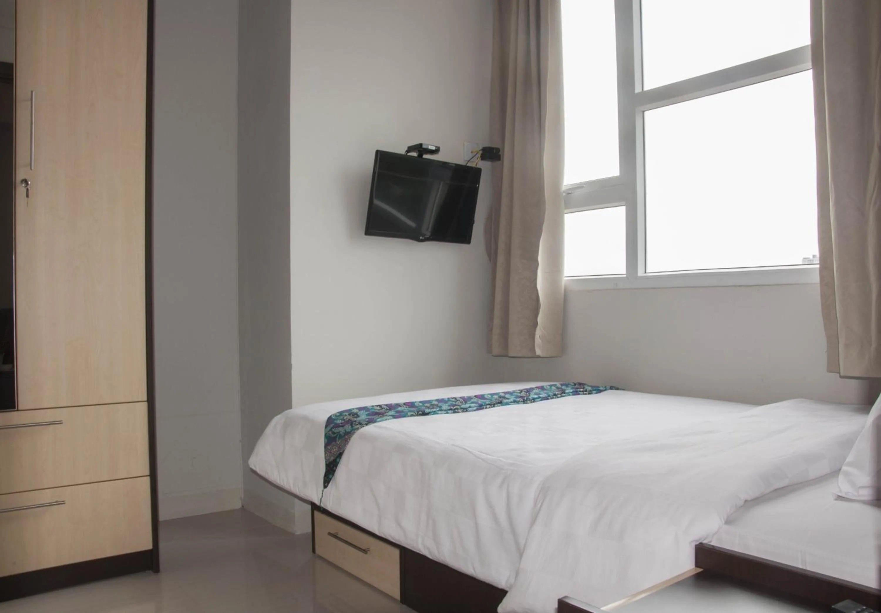 Bed in Skyland City Hotel Jatinangor