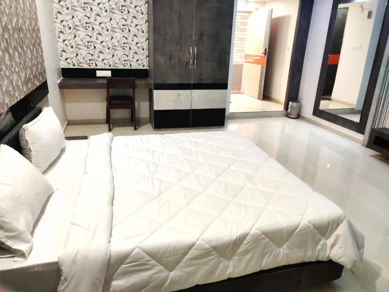 Bed in The Grand Takshak Hotel