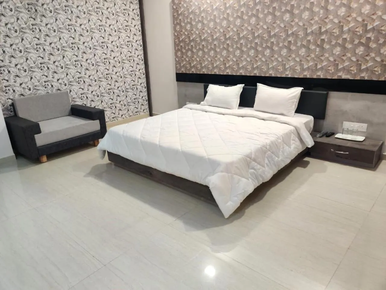 Bed in The Grand Takshak Hotel