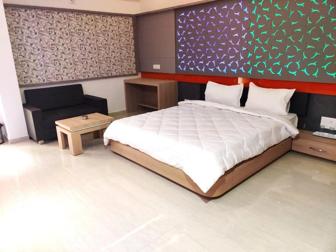 Bed in The Grand Takshak Hotel