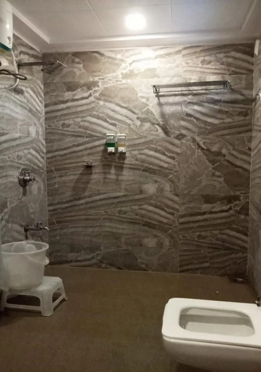 Shower in The Grand Takshak Hotel