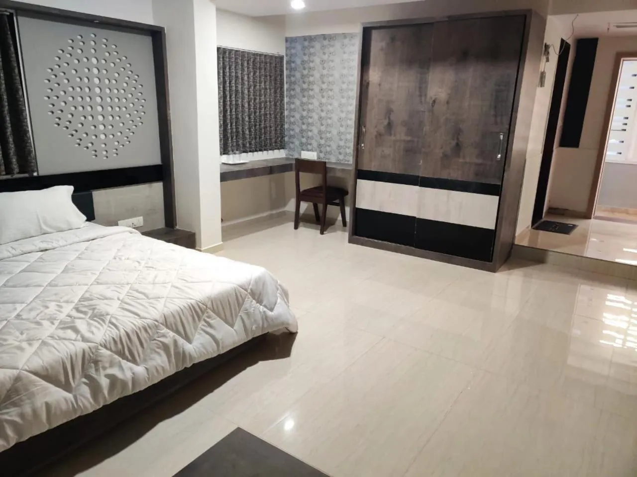 Bed in The Grand Takshak Hotel