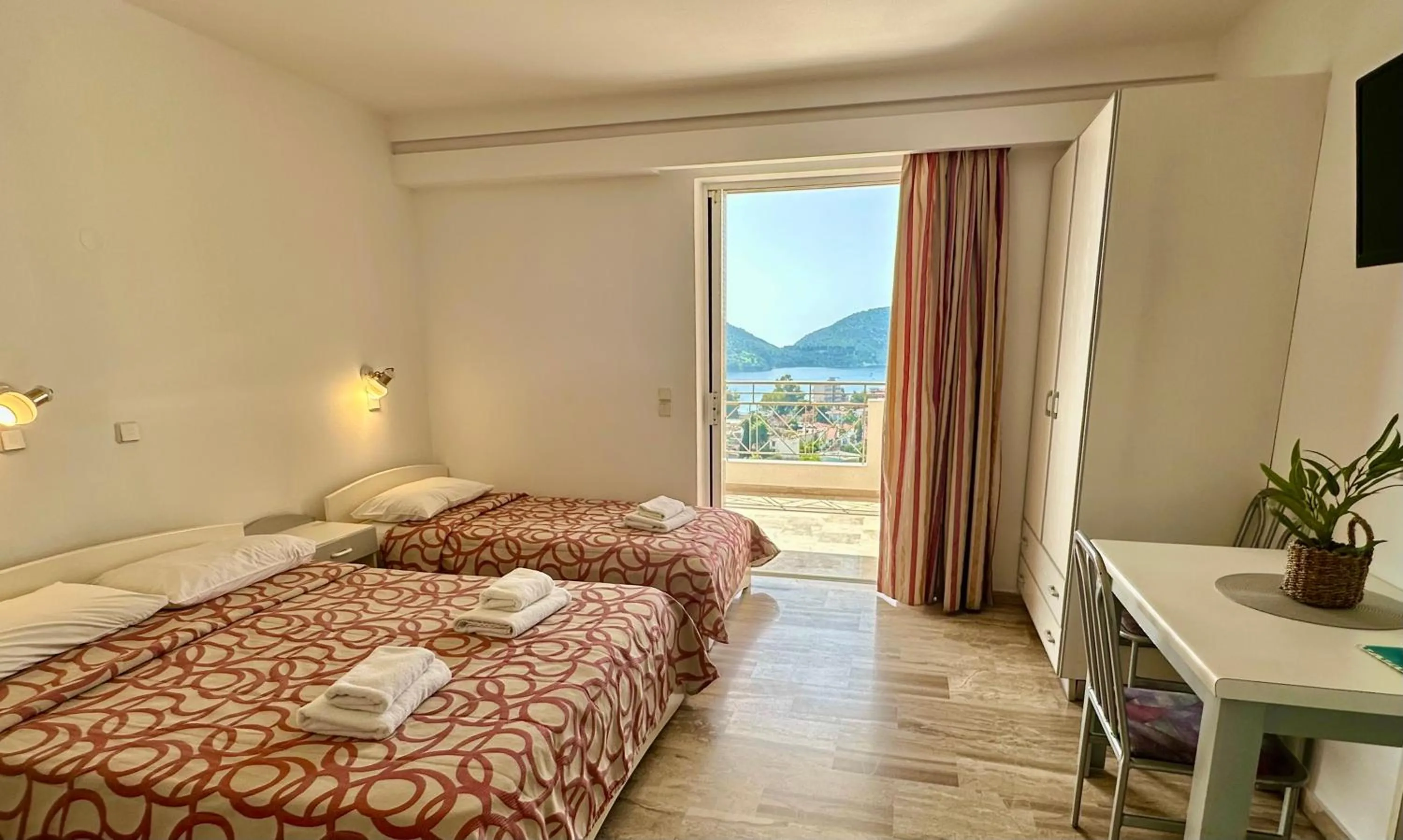 Bed in Hotel Apartments Panorama