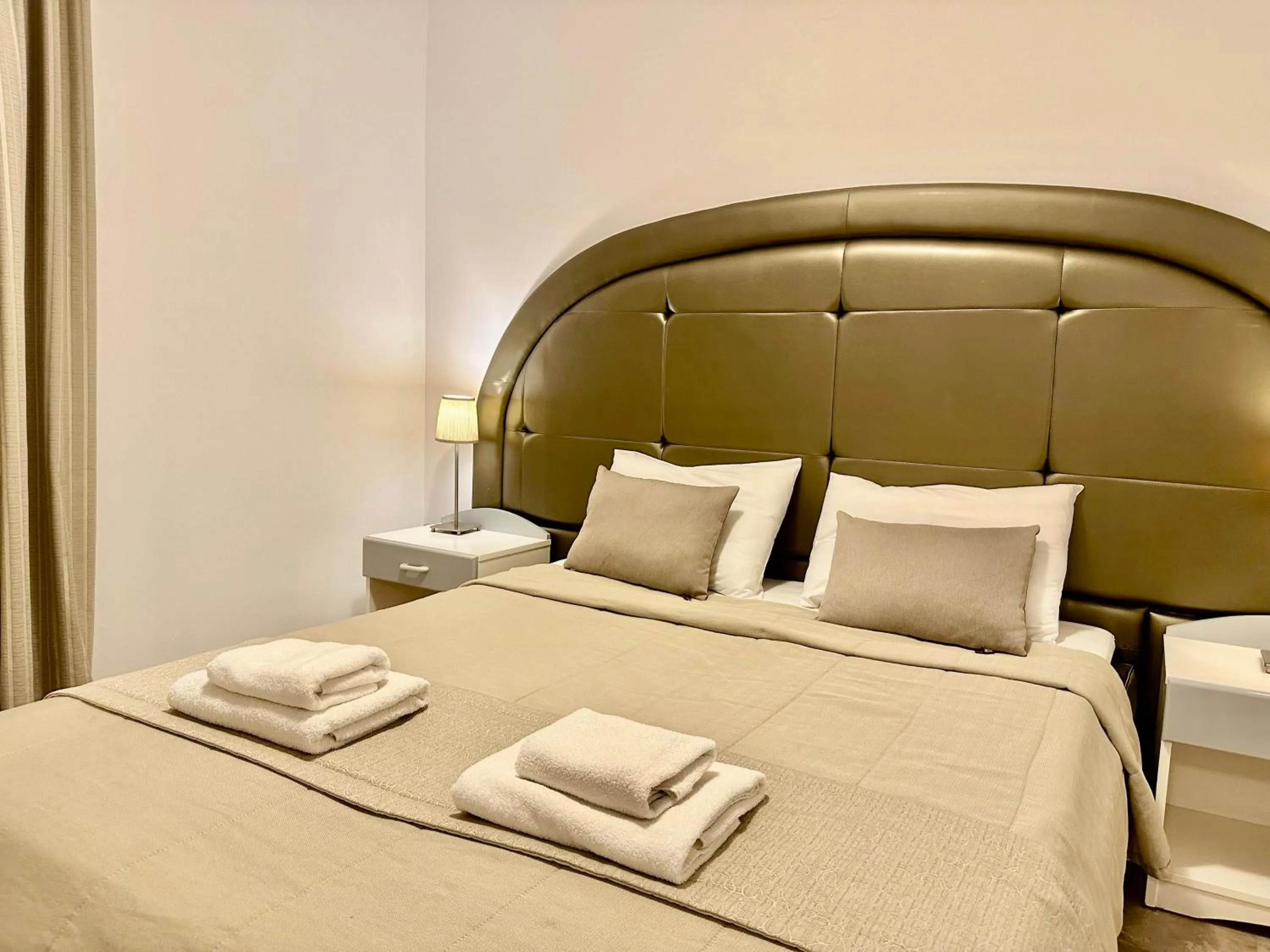 Bed in Hotel Apartments Panorama