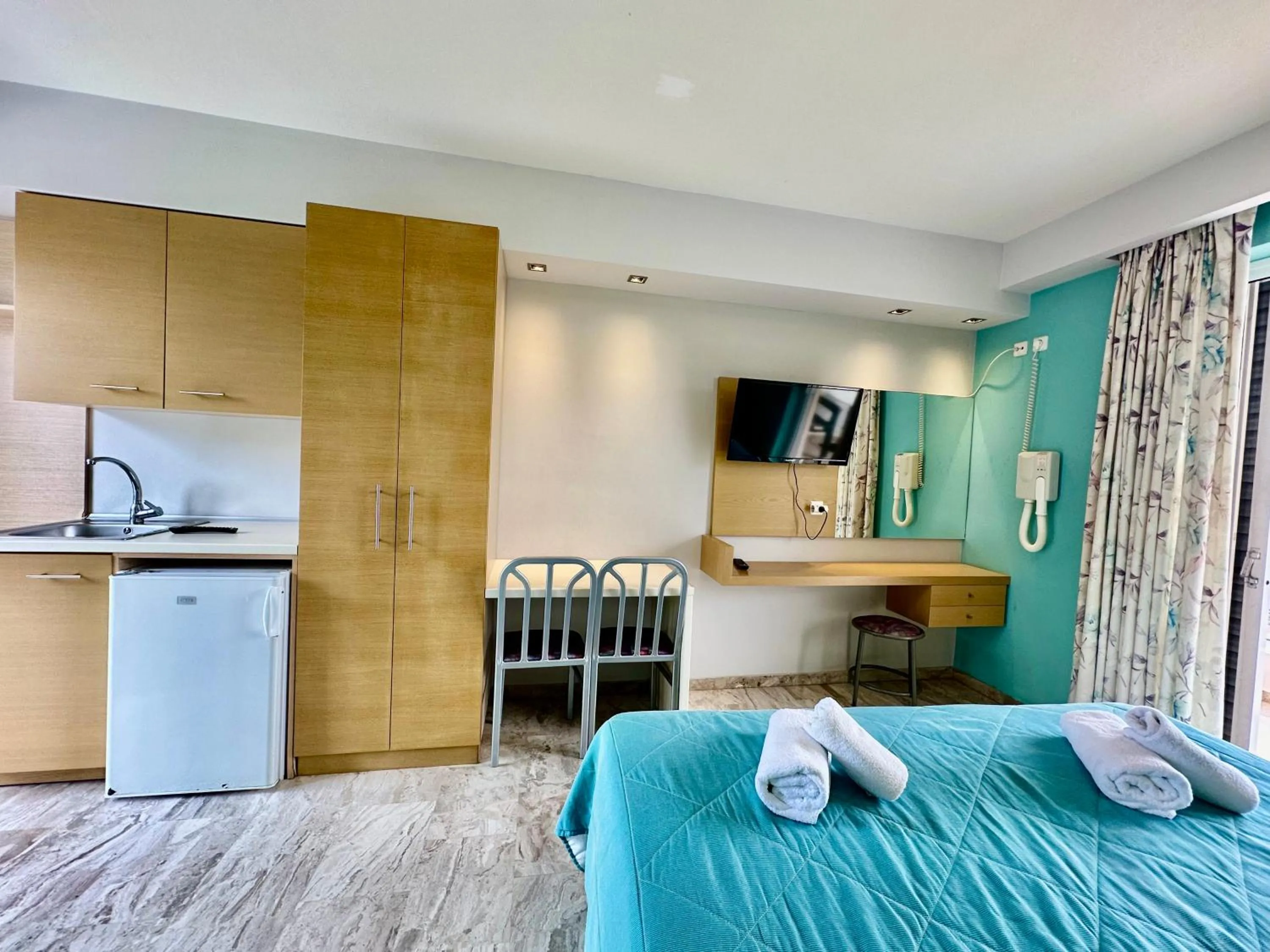 Bed in Hotel Apartments Panorama