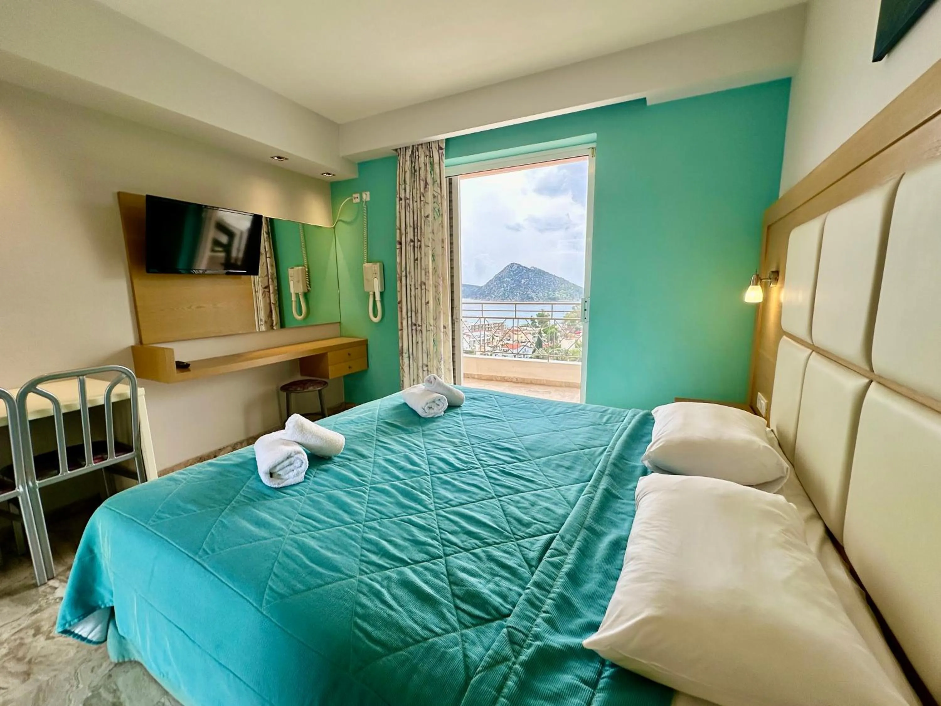 Bed in Hotel Apartments Panorama