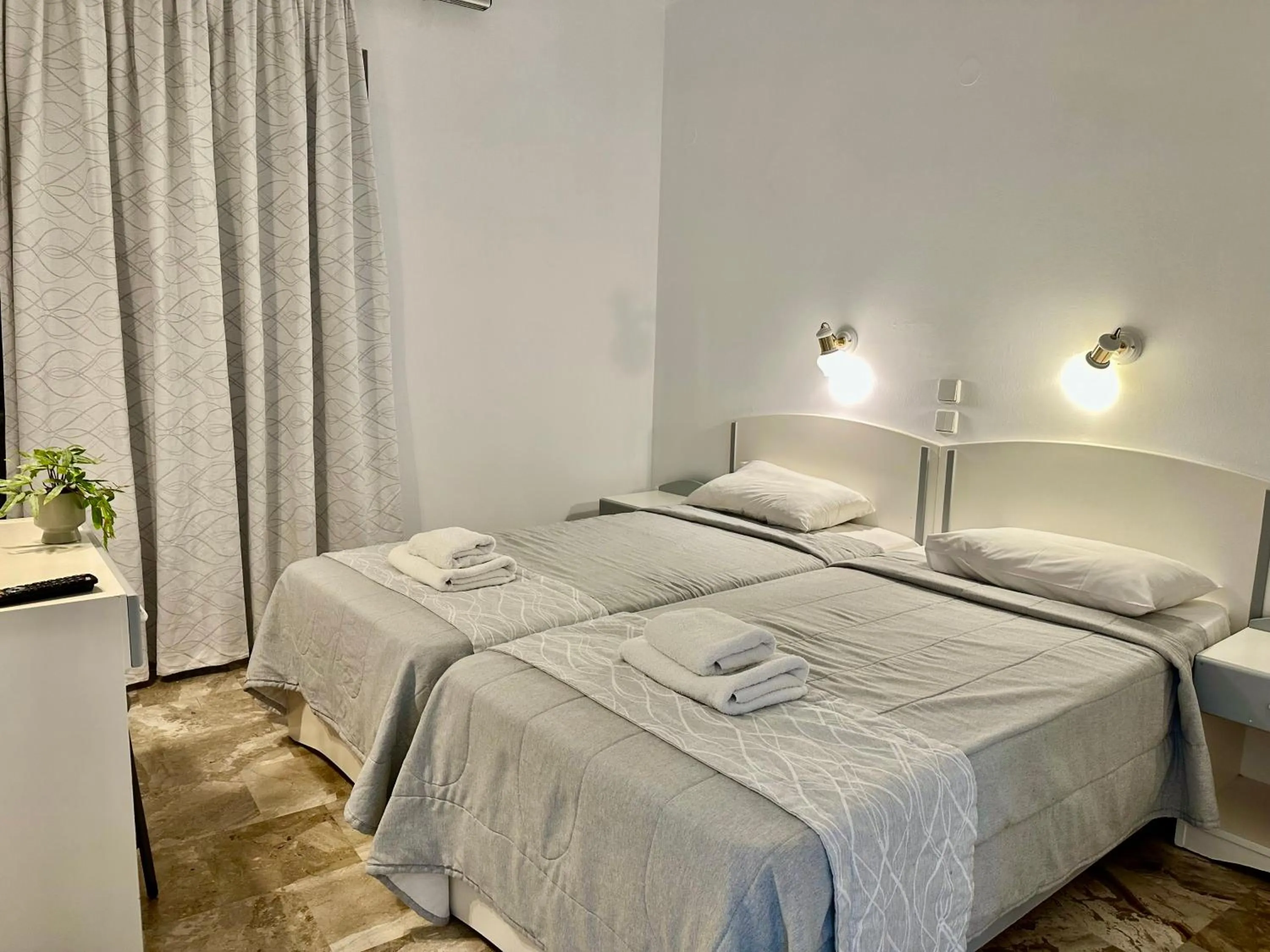 Bed in Hotel Apartments Panorama