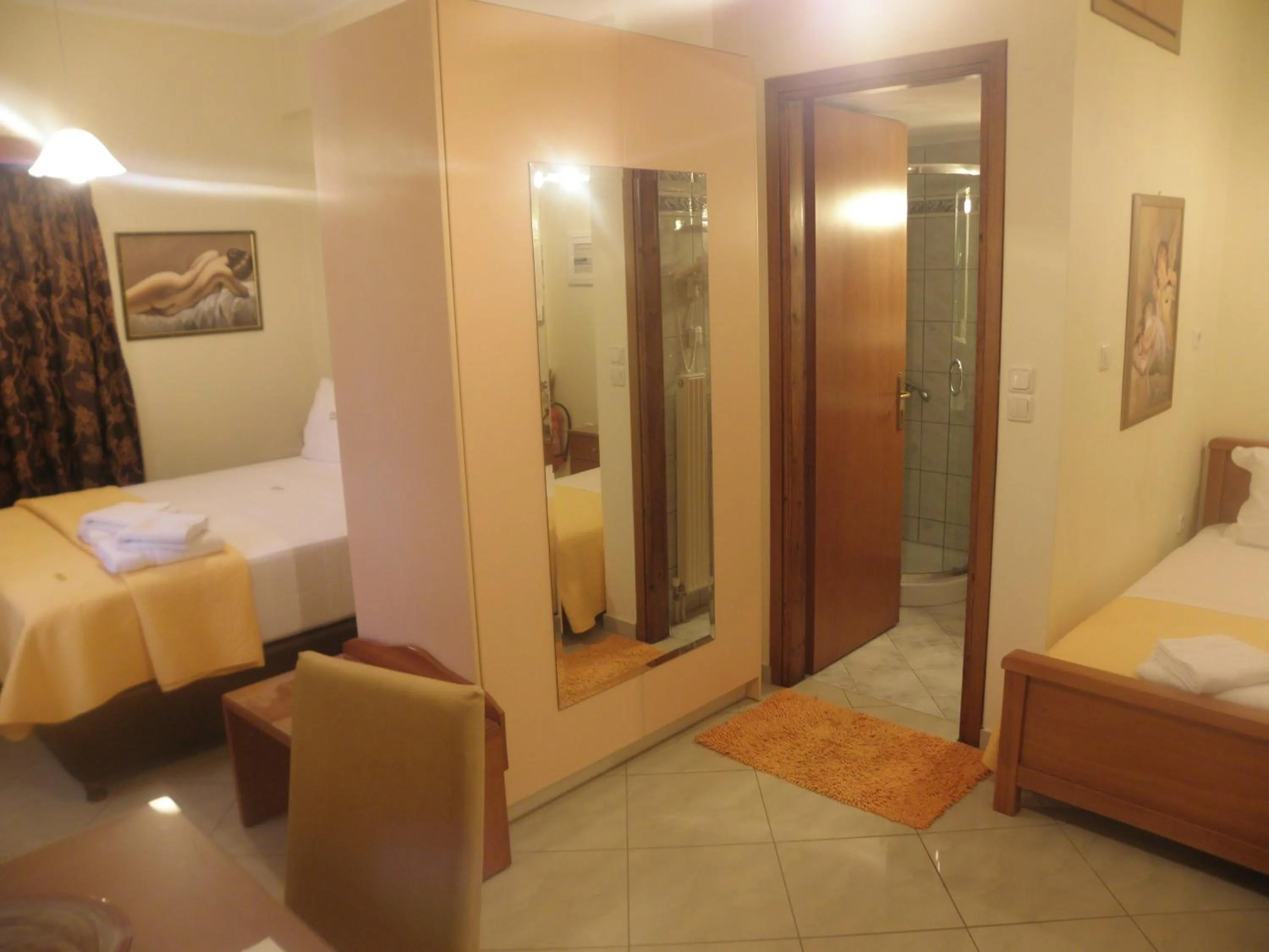 Bed in Irida Beach Resort Suites