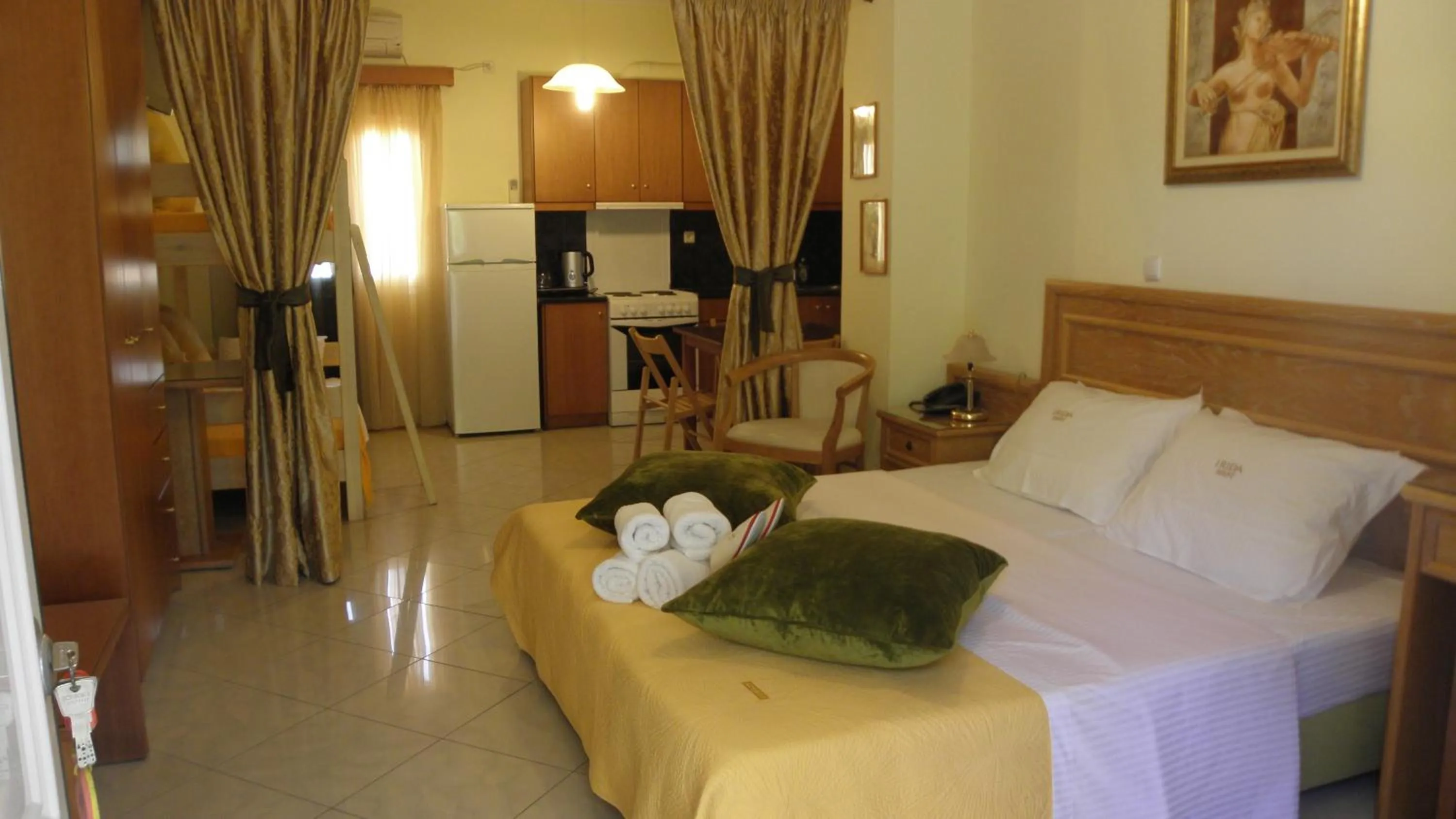 TV and multimedia, Bed in Irida Beach Resort Suites