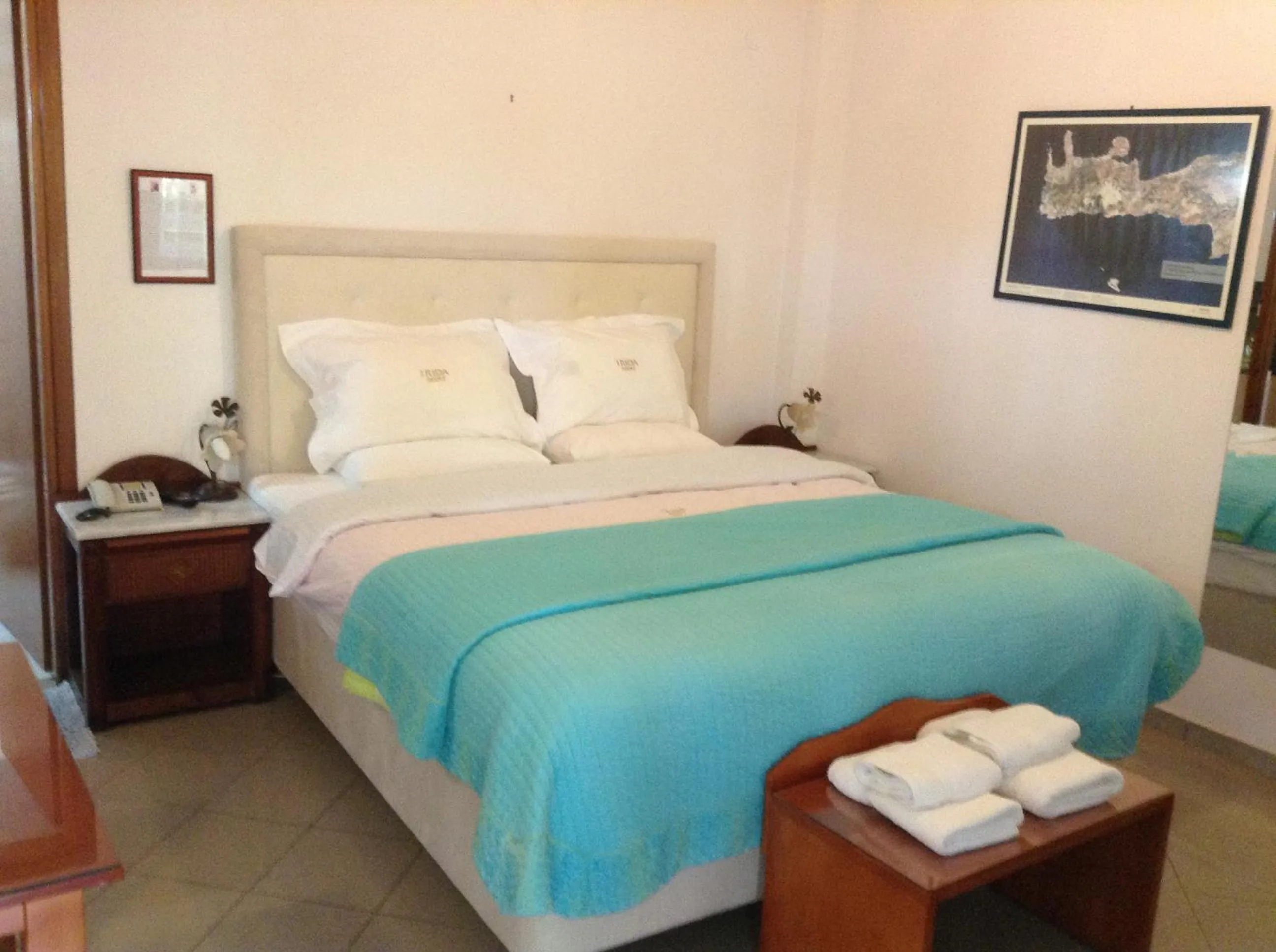 Bed in Irida Beach Resort Suites