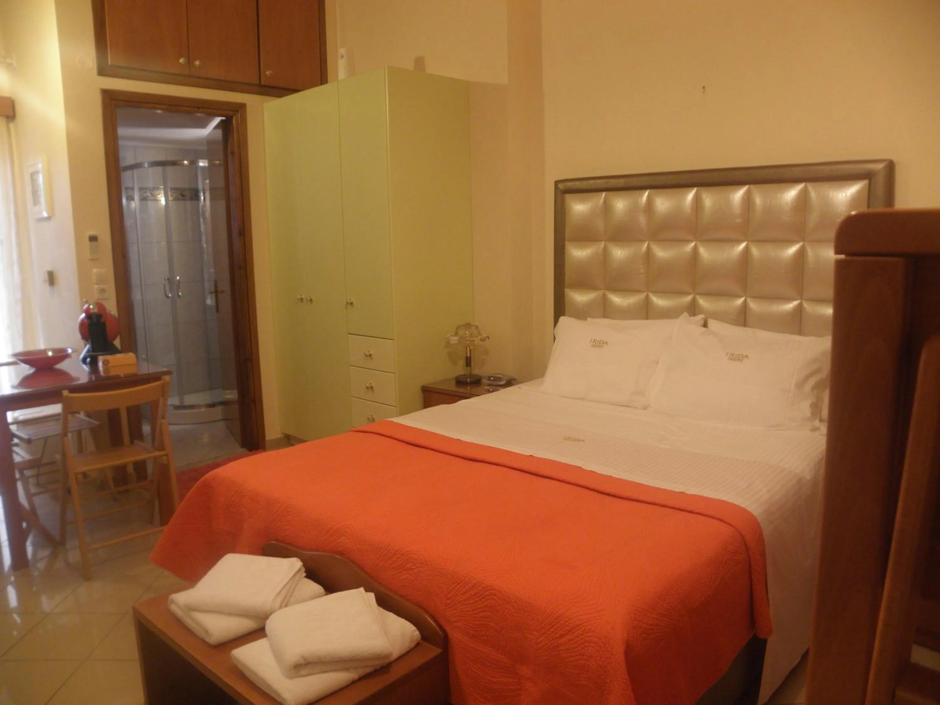 Bed in Irida Beach Resort Suites