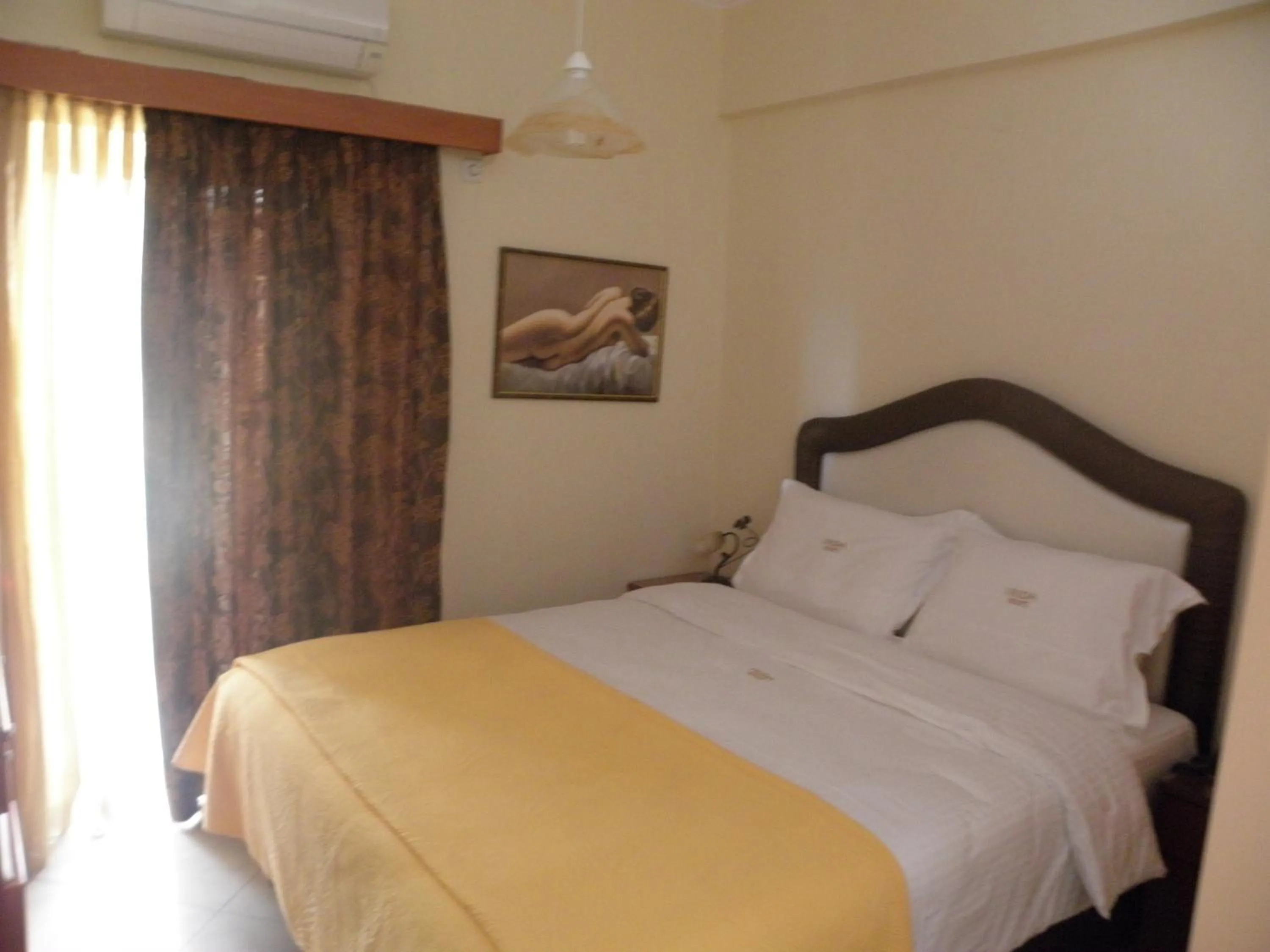 Bed in Irida Beach Resort Suites