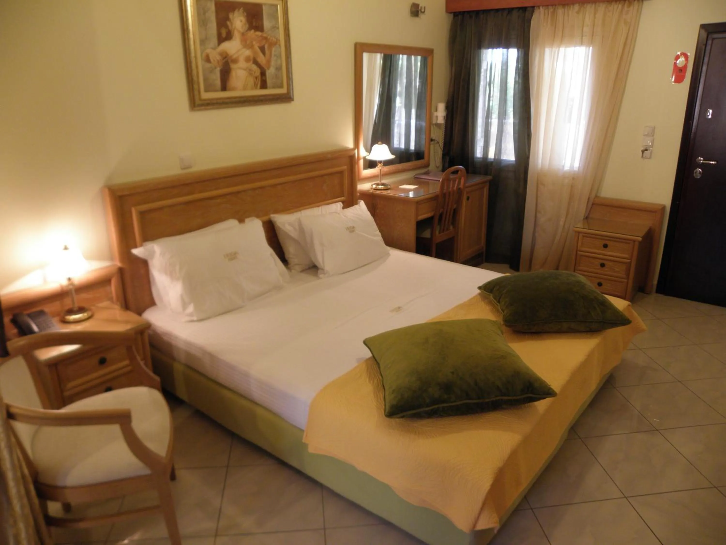 Bed in Irida Beach Resort Suites