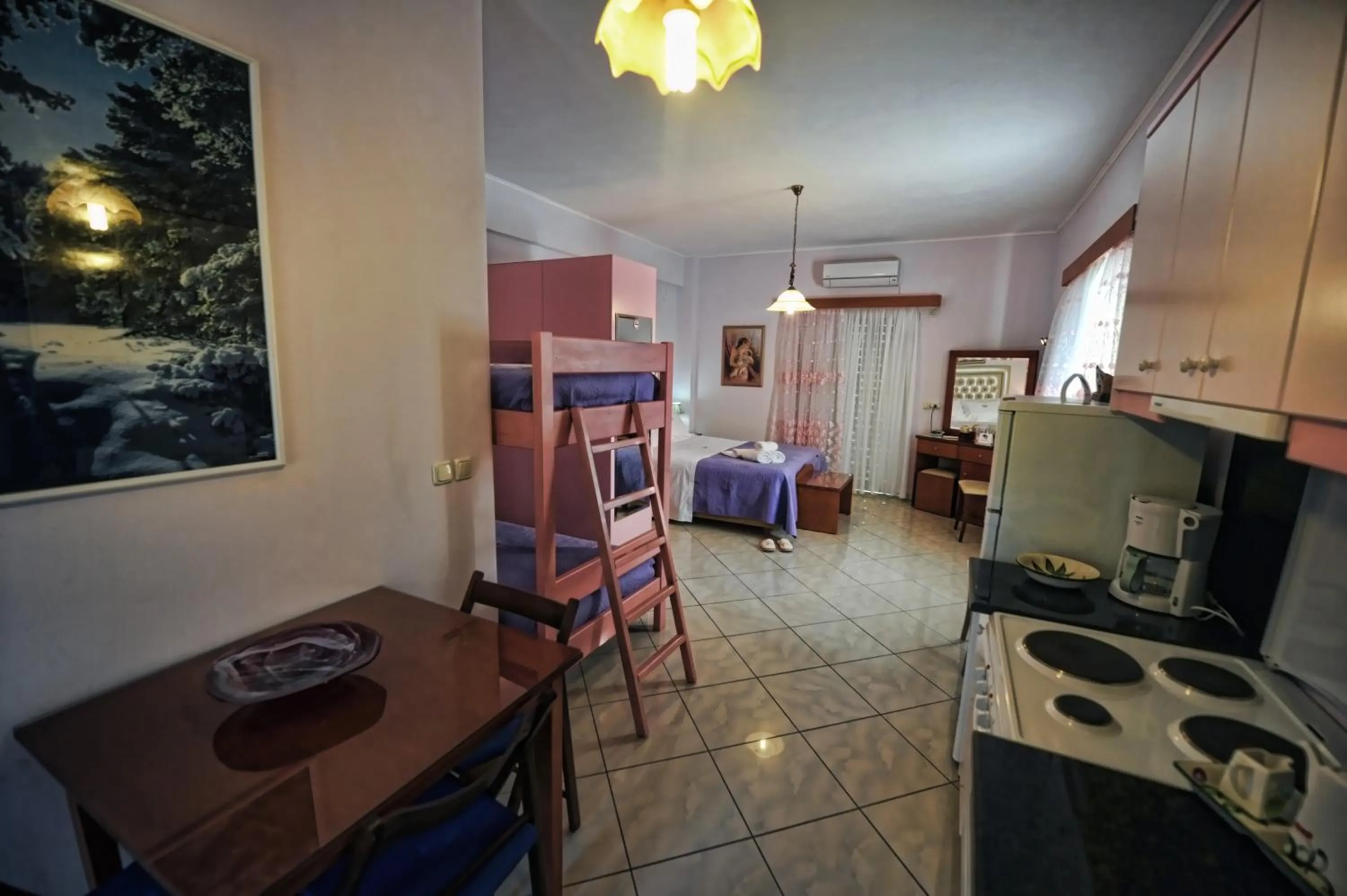 Bed in Irida Beach Resort Suites