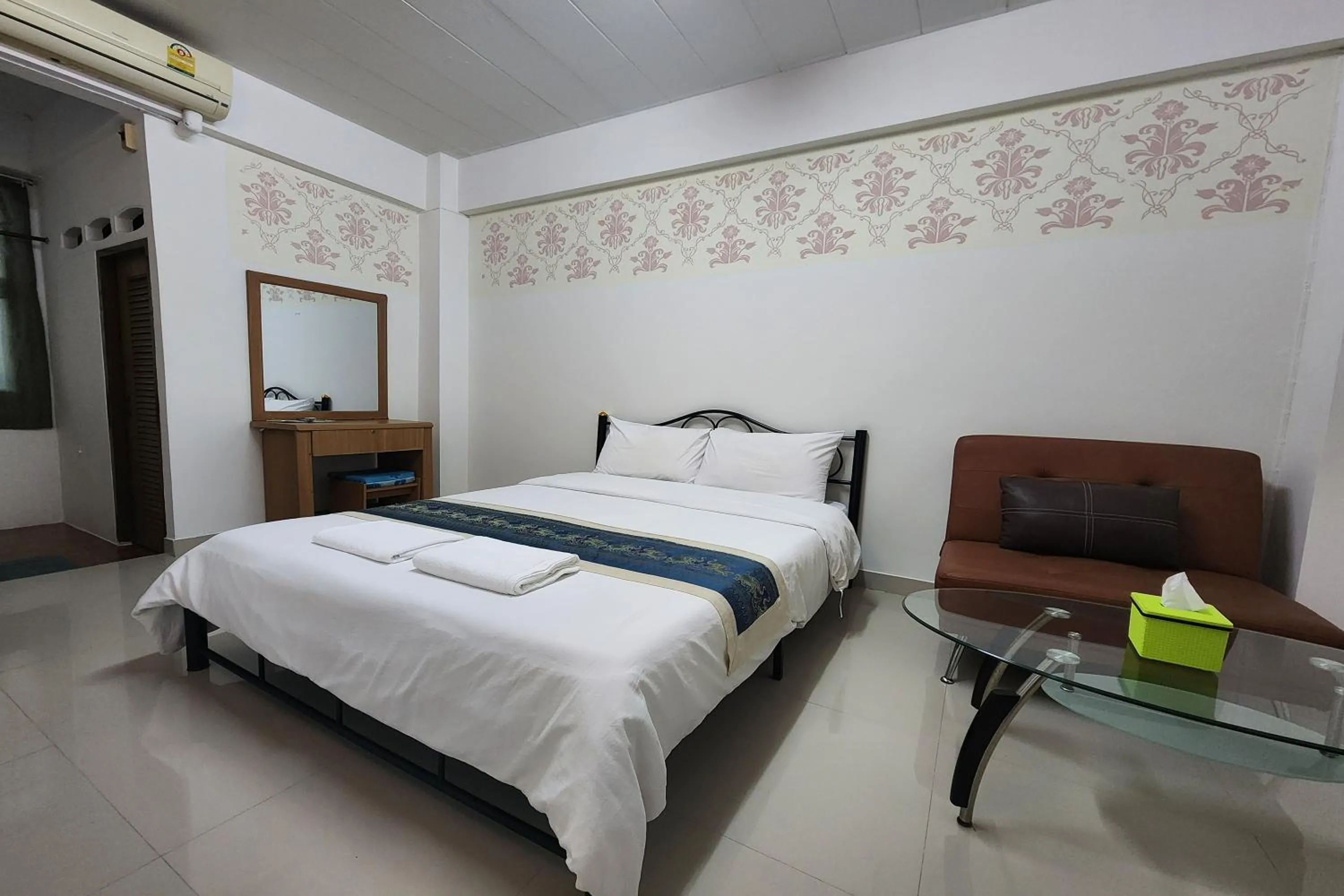 Bed in Green Apartment Kaset