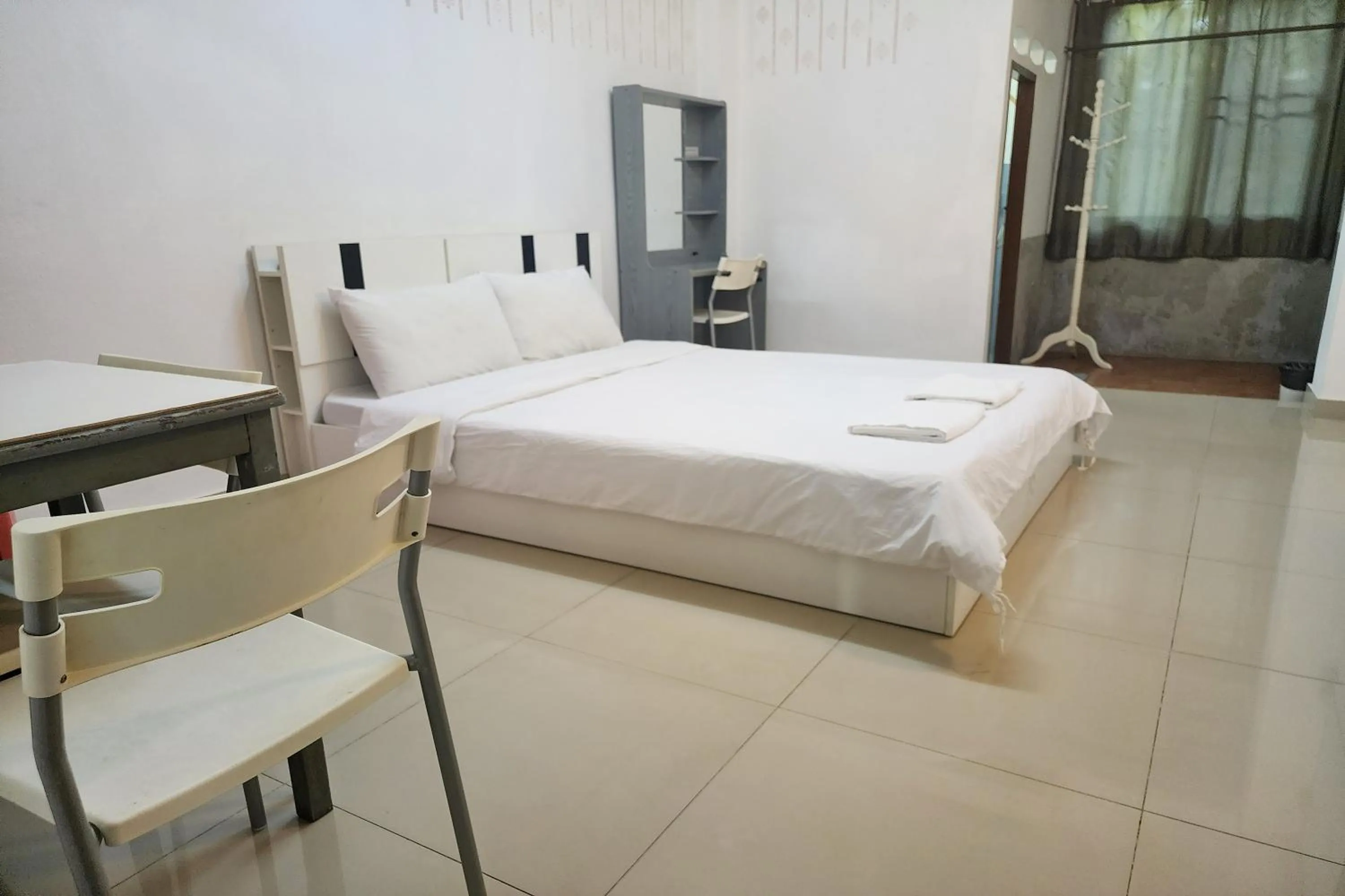 Bed in Green Apartment Kaset