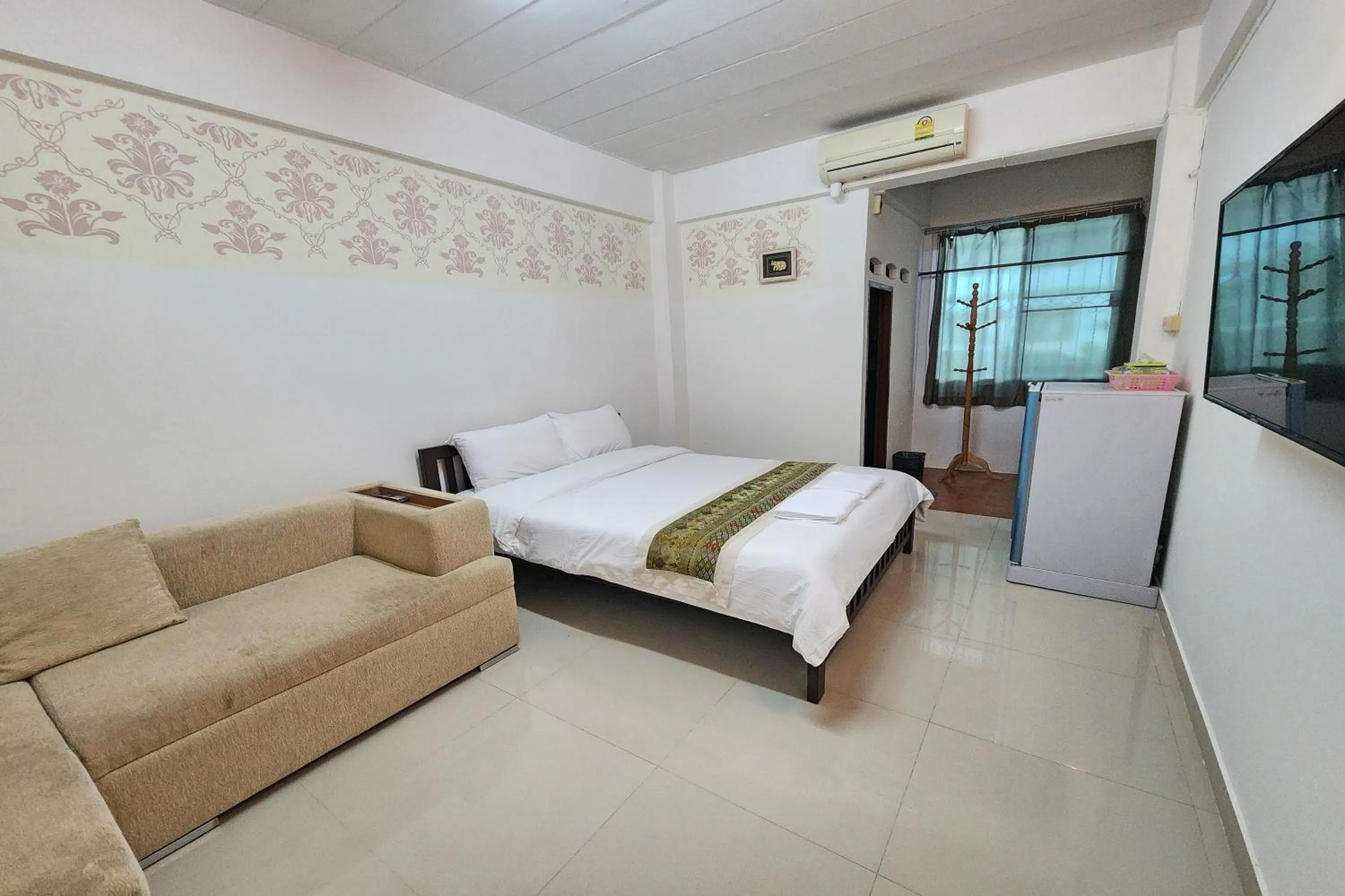 Bed in Green Apartment Kaset