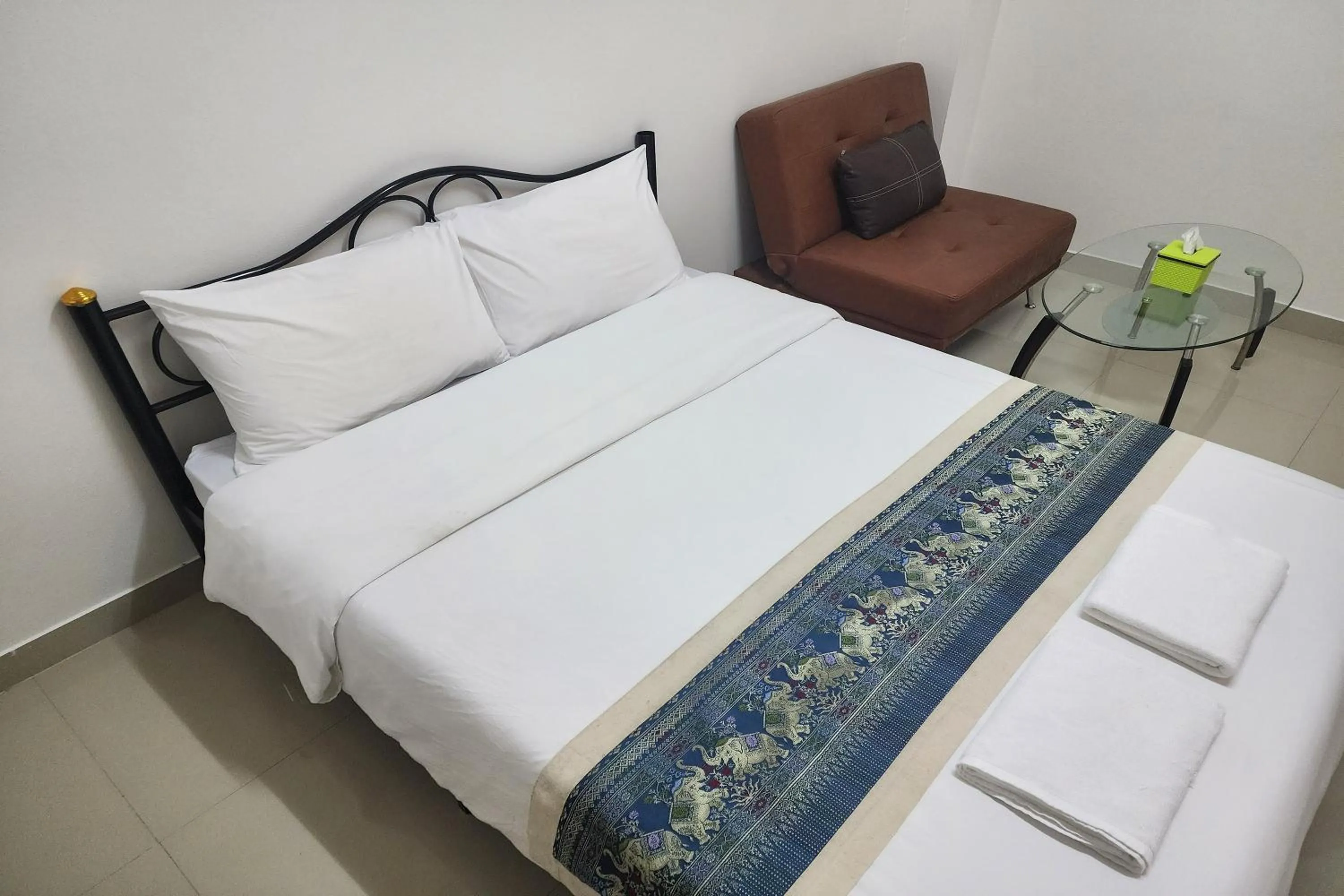 Bed in Green Apartment Kaset