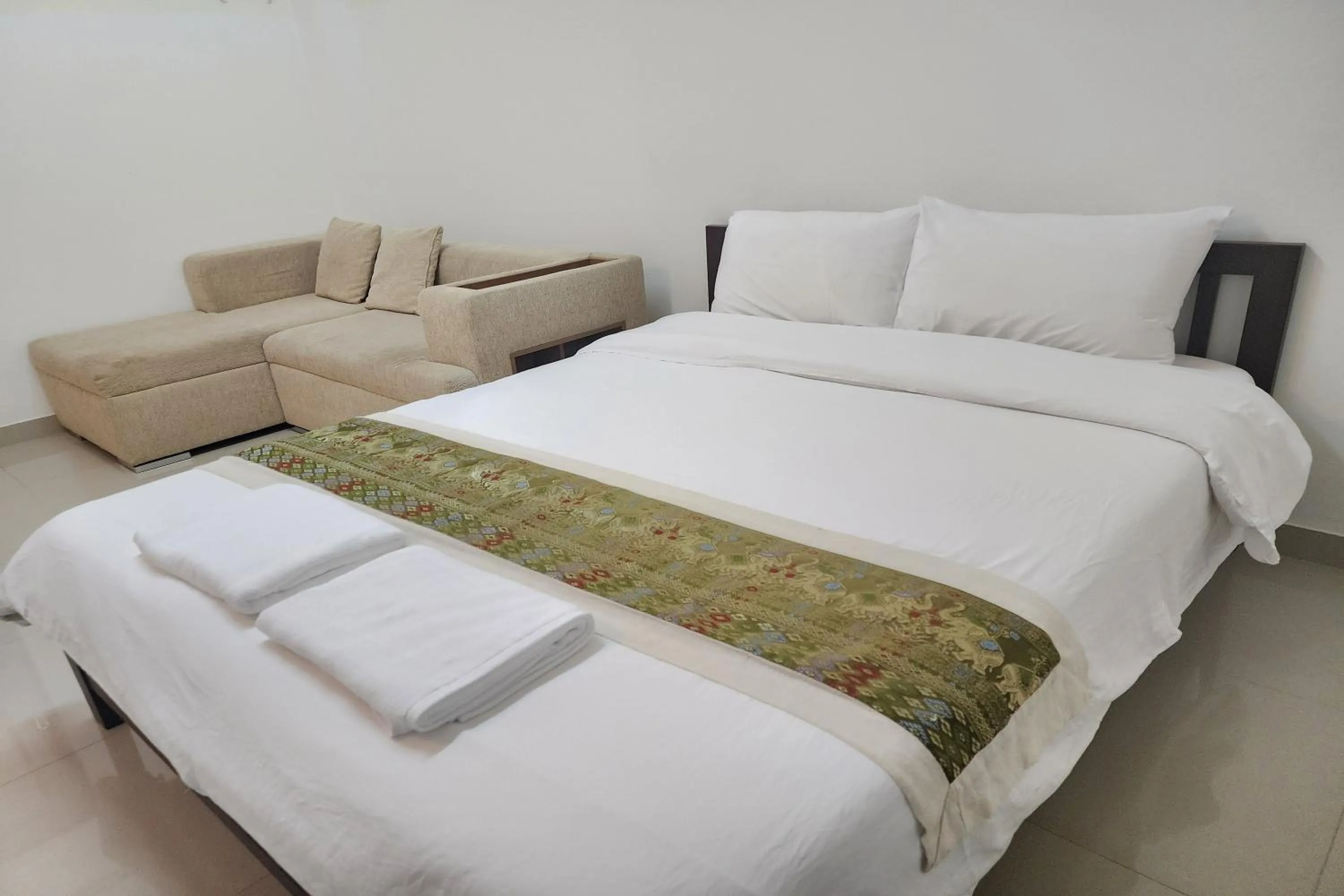 Bed in Green Apartment Kaset