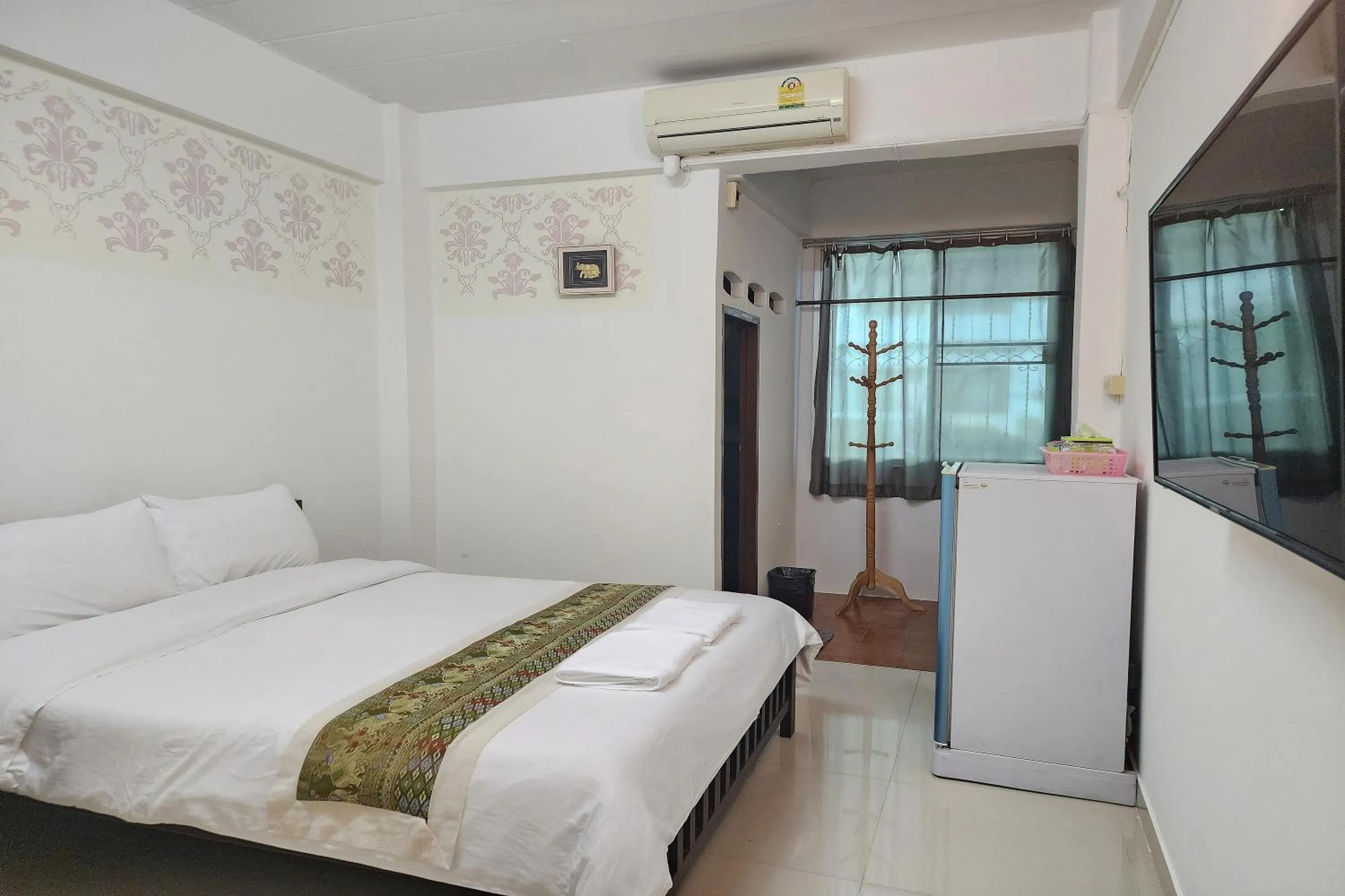 Bed in Green Apartment Kaset