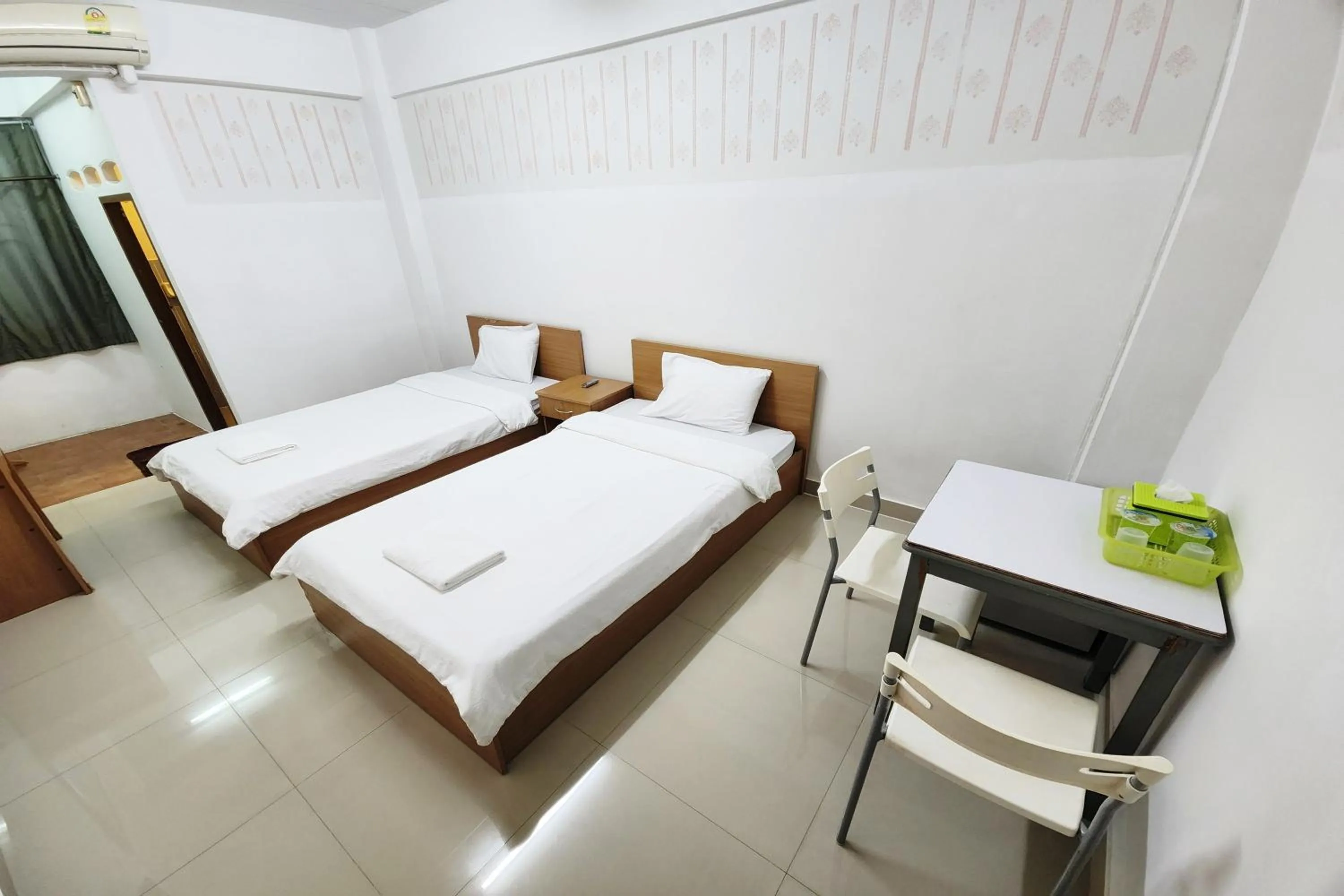 Bed in Green Apartment Kaset